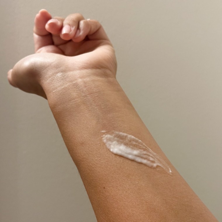 A swatch of Cerave's Daily Moisturizing Lotion on the arm of NBC Select associate reporter Bianca Alvarez shows how thin, runny, and lightweight the white moisturizer is on her eczema-prone skin.