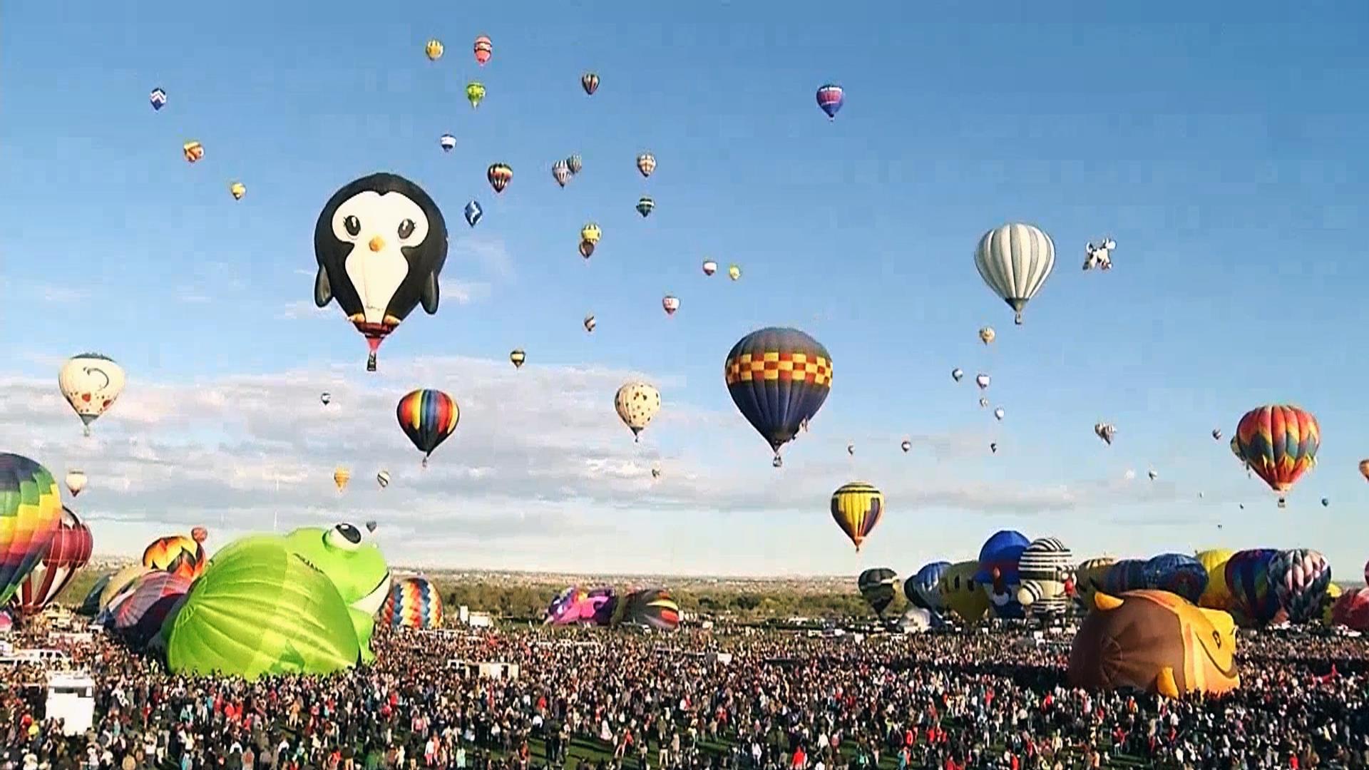 Hot air balloons of different shapes and sizes took off for the skies in Al...
