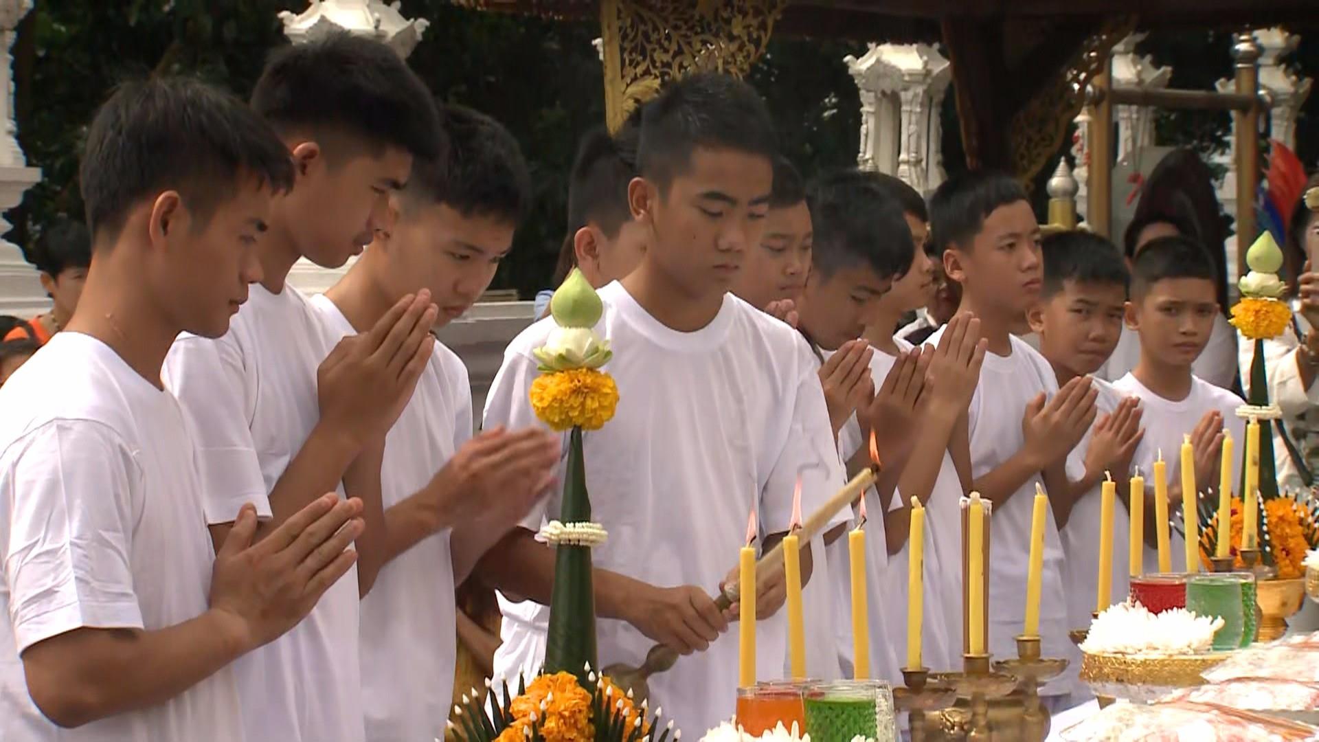 Thai soccer players rescued from cave take part in Buddhist training