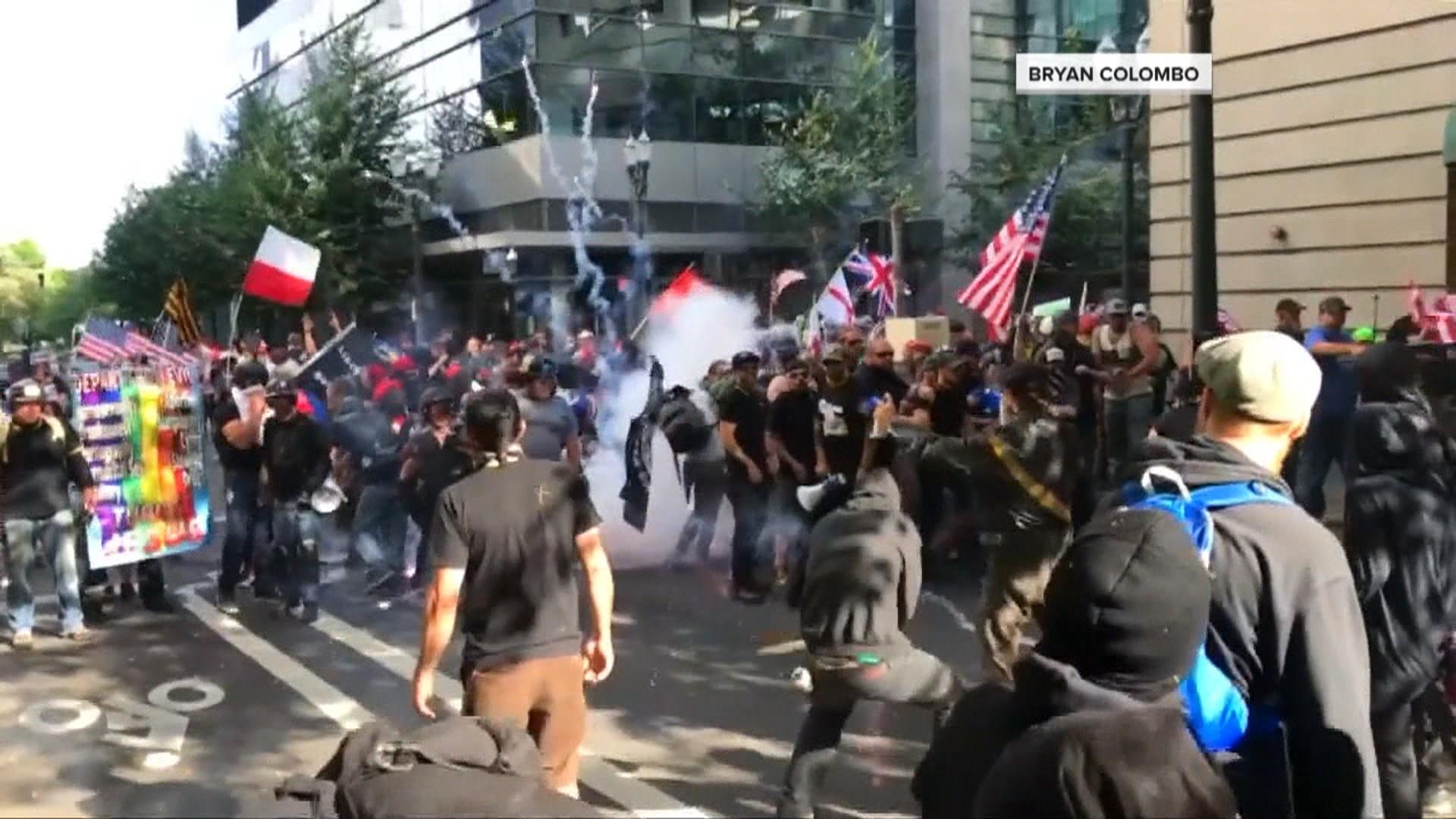 Fights break out as dueling protests clash in Portland, federal
