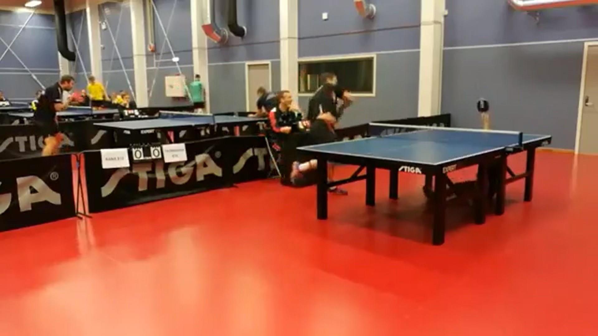 Table tennis player strikes bowling pins with ping-pong balls