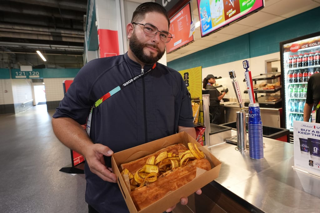 Sol Cubano chef Lázaro Luya demonstrates his special dish with suckling pig and fresh ladybugs at Miami Stadium on June 21, 2026.