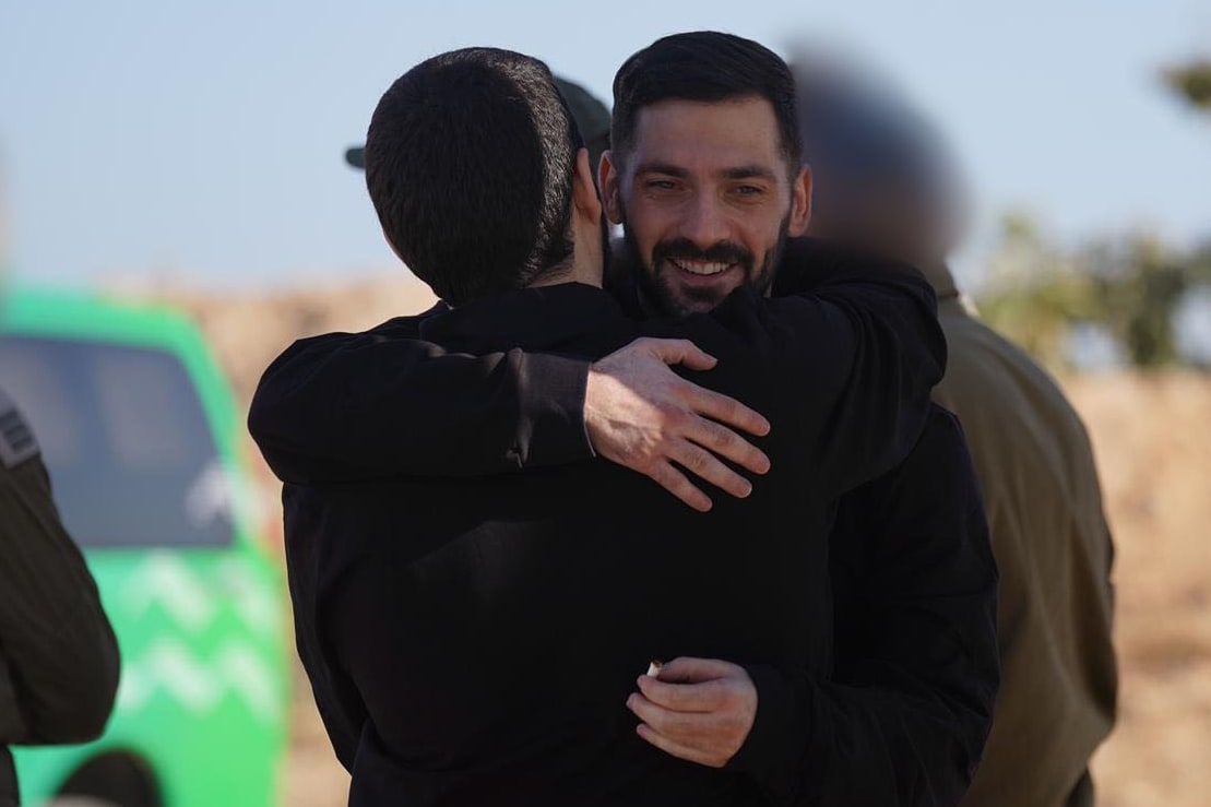 Israeli hostages cross back from Gaza into Israel on Oct. 13, 2025.