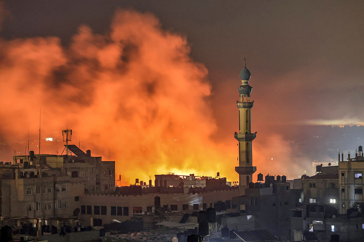 Fire and smoke erupt after Israeli bombardment in Rafah in the southern Gaza Strip on December 14, 2023.
