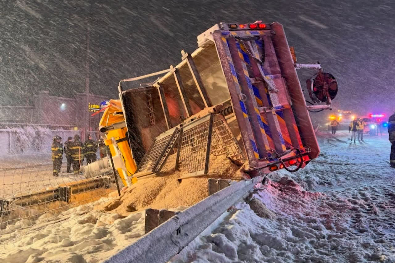 An overturned plow truck