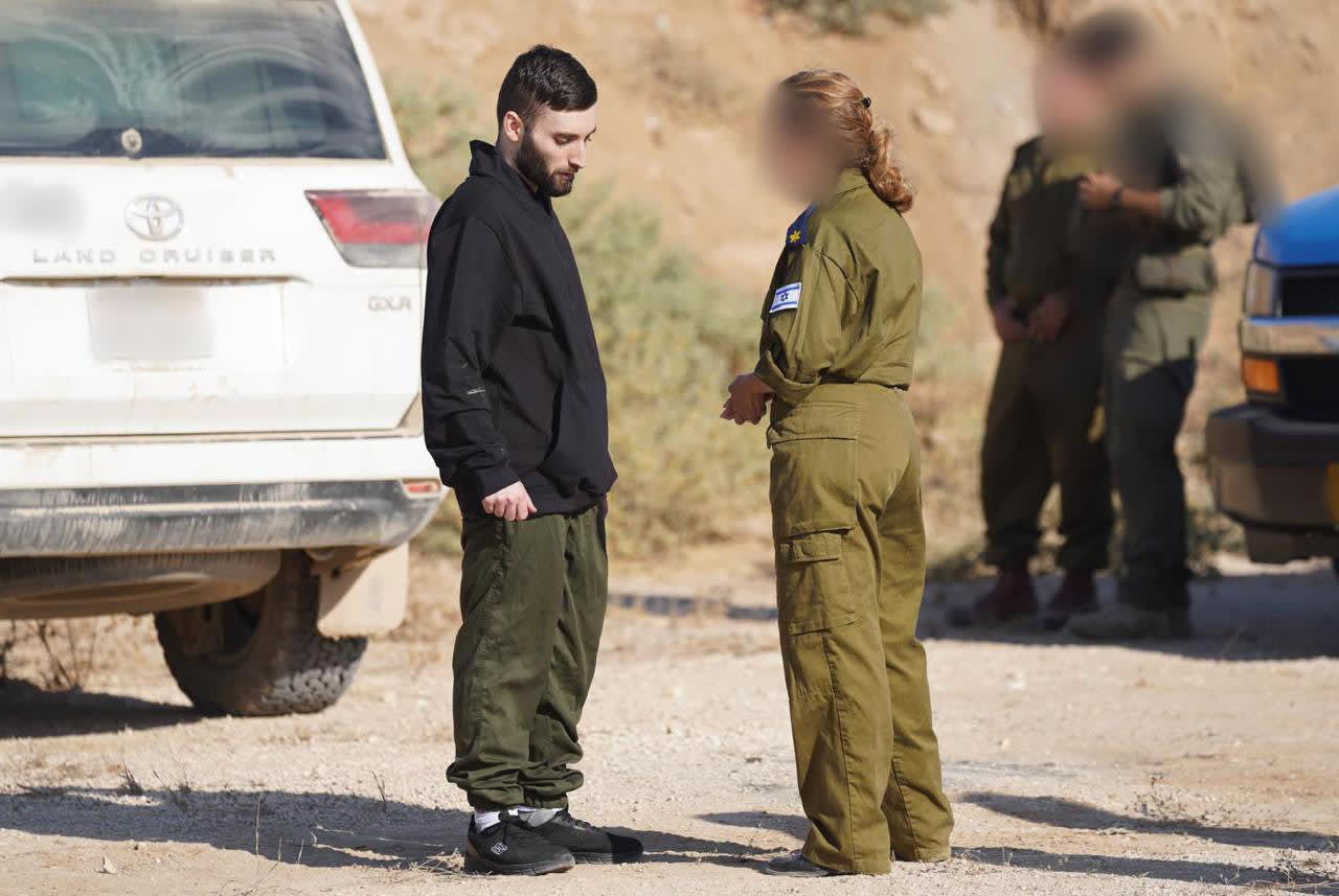 Israeli hostages cross back from Gaza into Israel on Oct. 13, 2025.