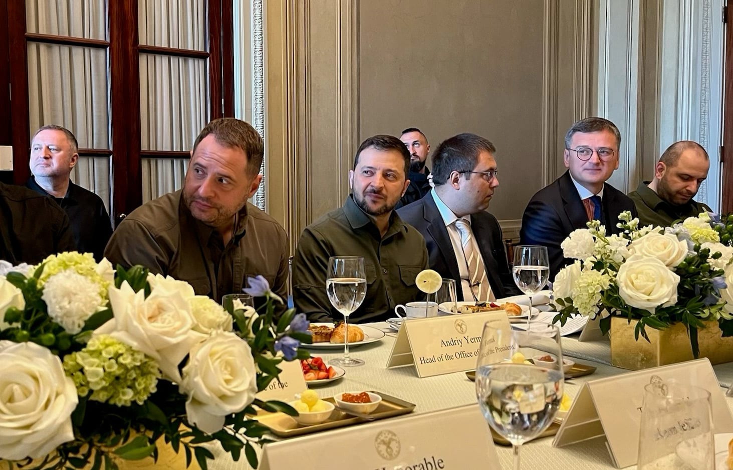 Ukrainian President Volodymyr Zelenskyy, center, sits with his staff at the Capitol on Sept. 21, 2023. 