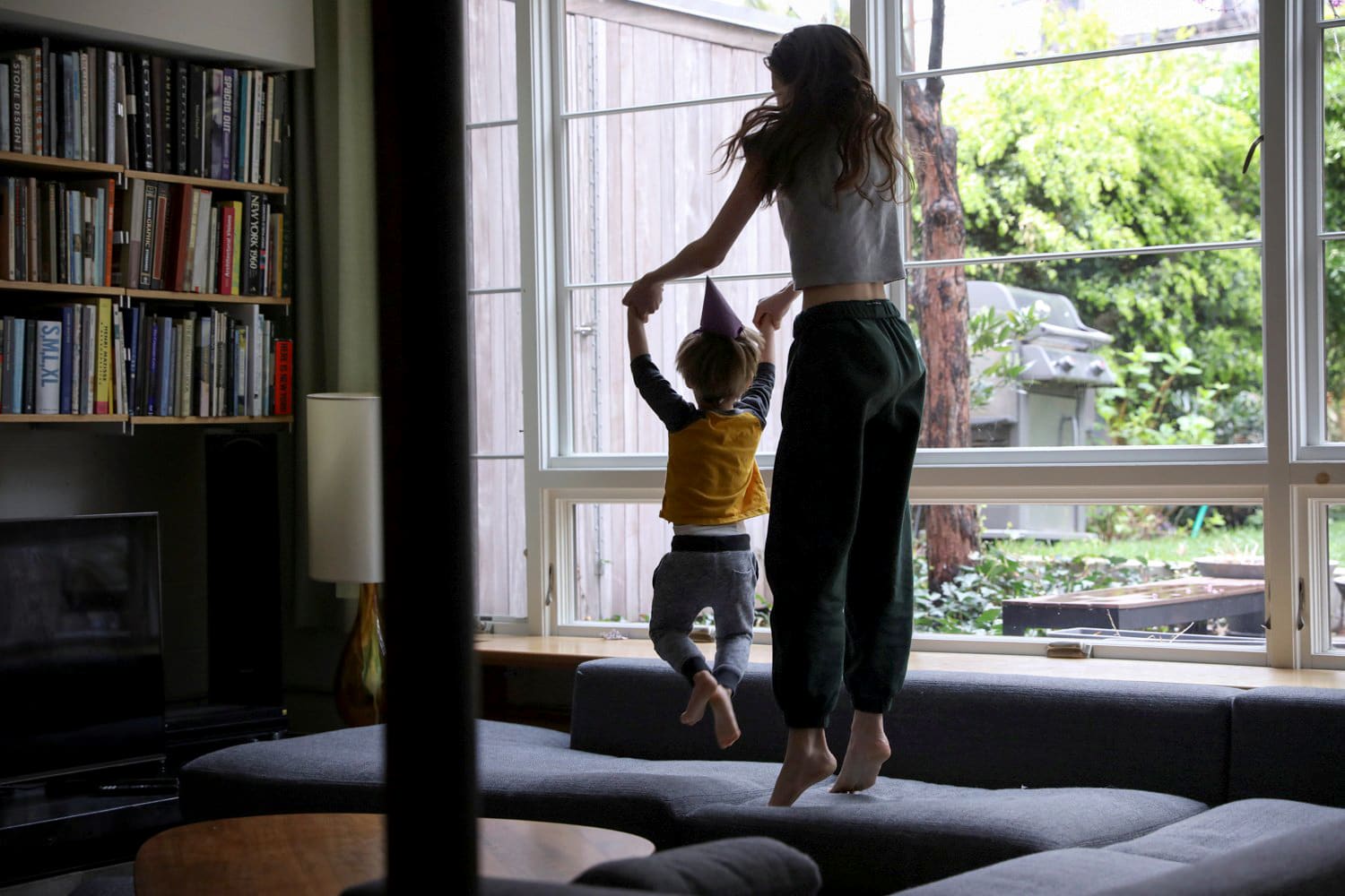 Image: Felix Hassebroek jumps on the couch with his sister, Jane, while celebrating his birthday at their Brooklyn home.