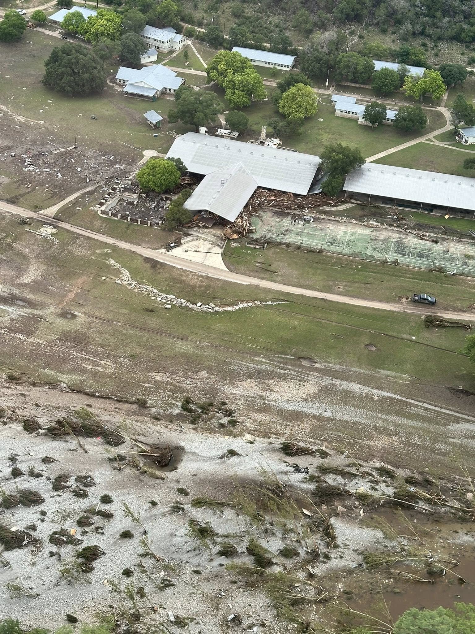 An aerial view of Camp La Junta outside, flood damage can be seen on the surrounding land