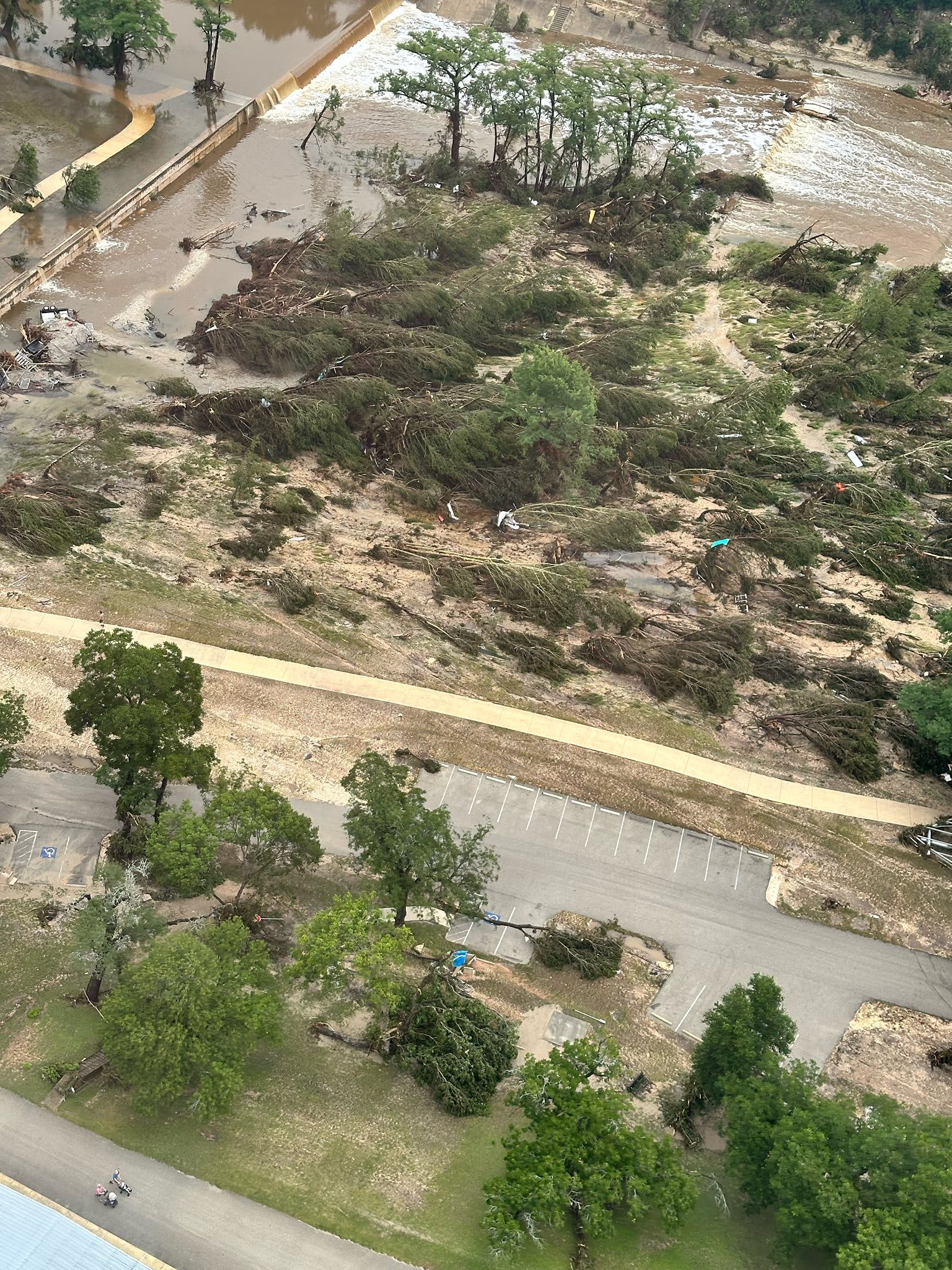 An aerial view of flood damage can be seen on the surrounding land