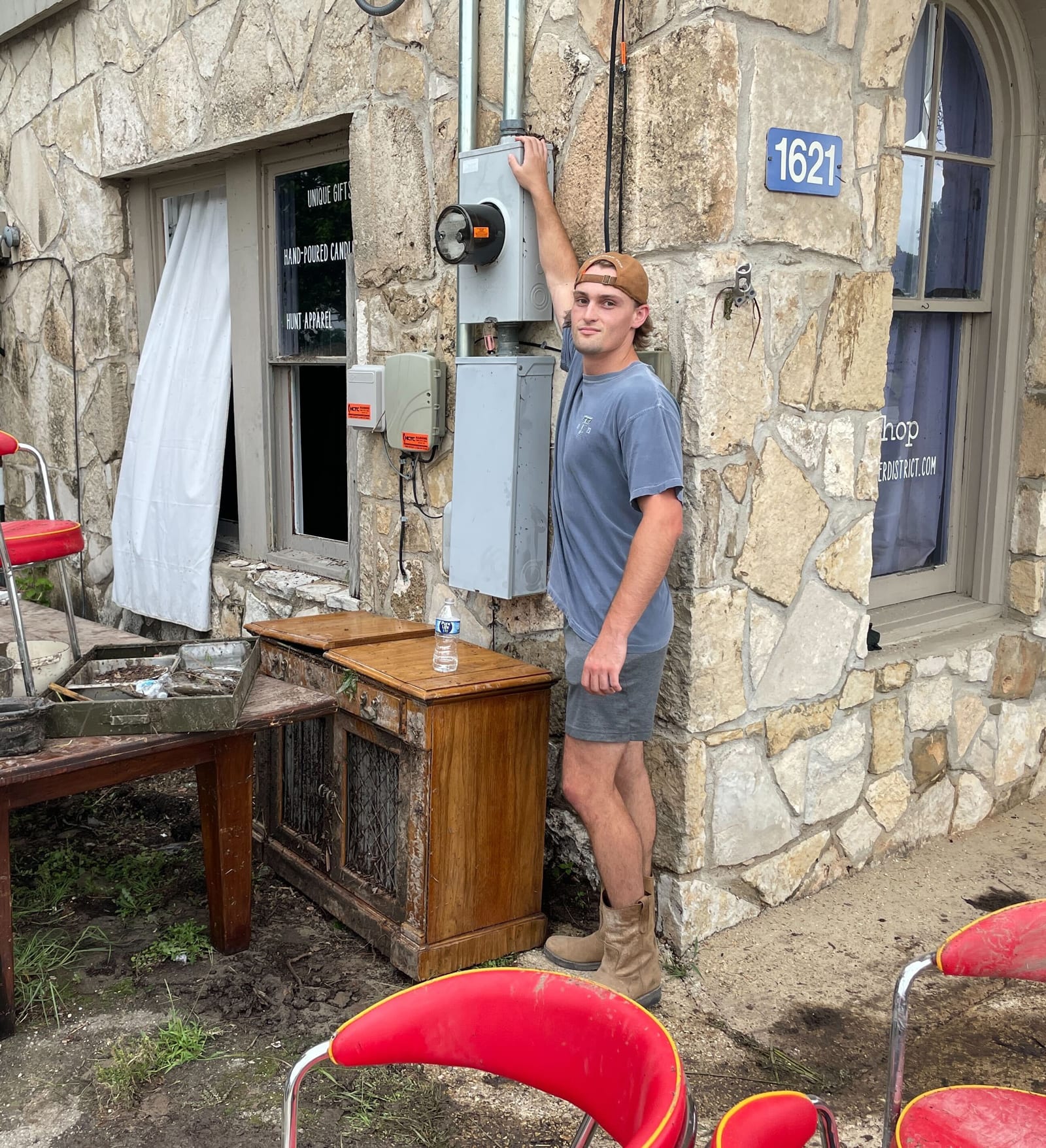 Christian Fell stands on the narrow top of a meter box