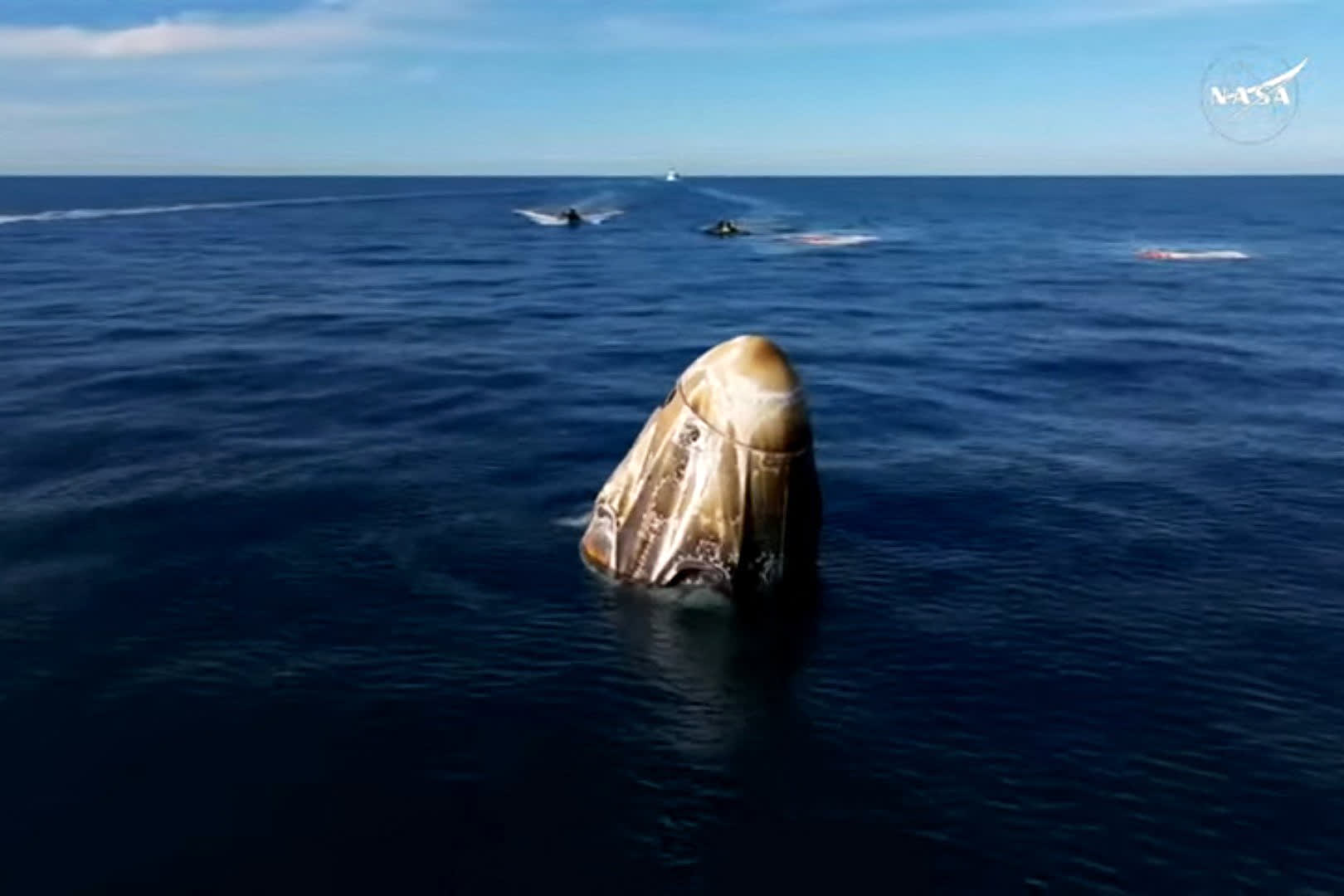 Image: dragon capsule post splashdown after