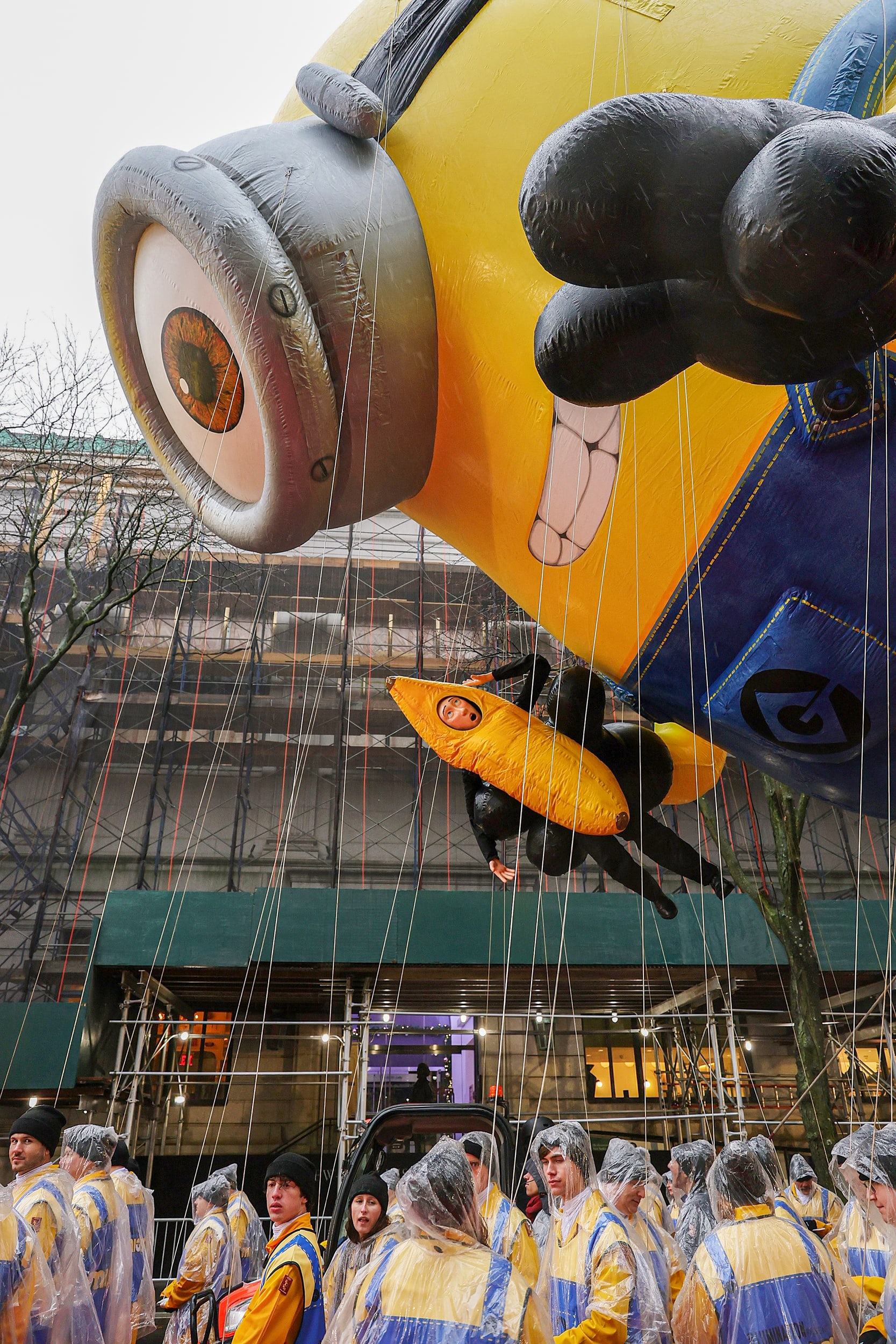 Parade participants and a minion balloon.