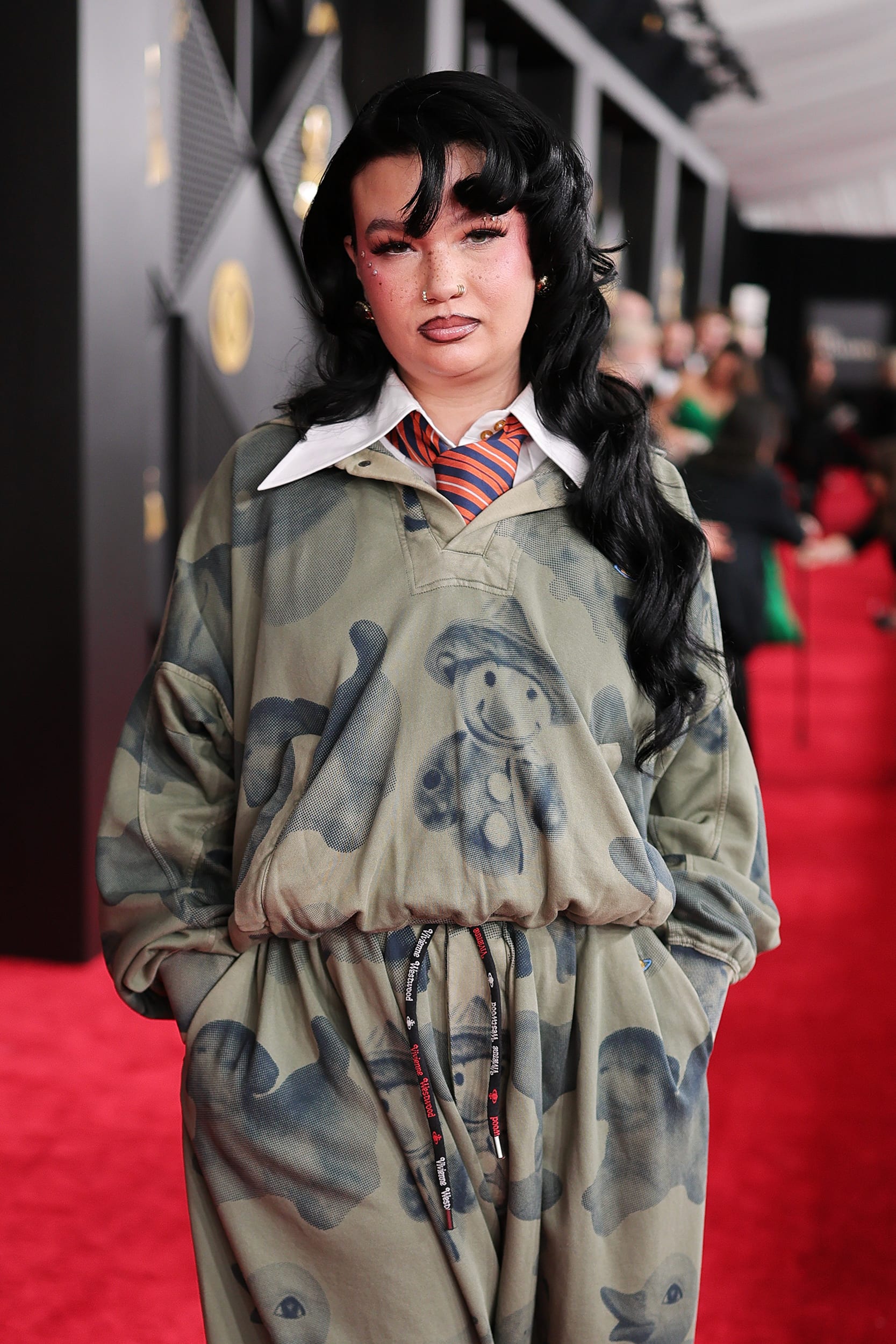 Lola Young poses for a photo on the red carpet at the Grammys.