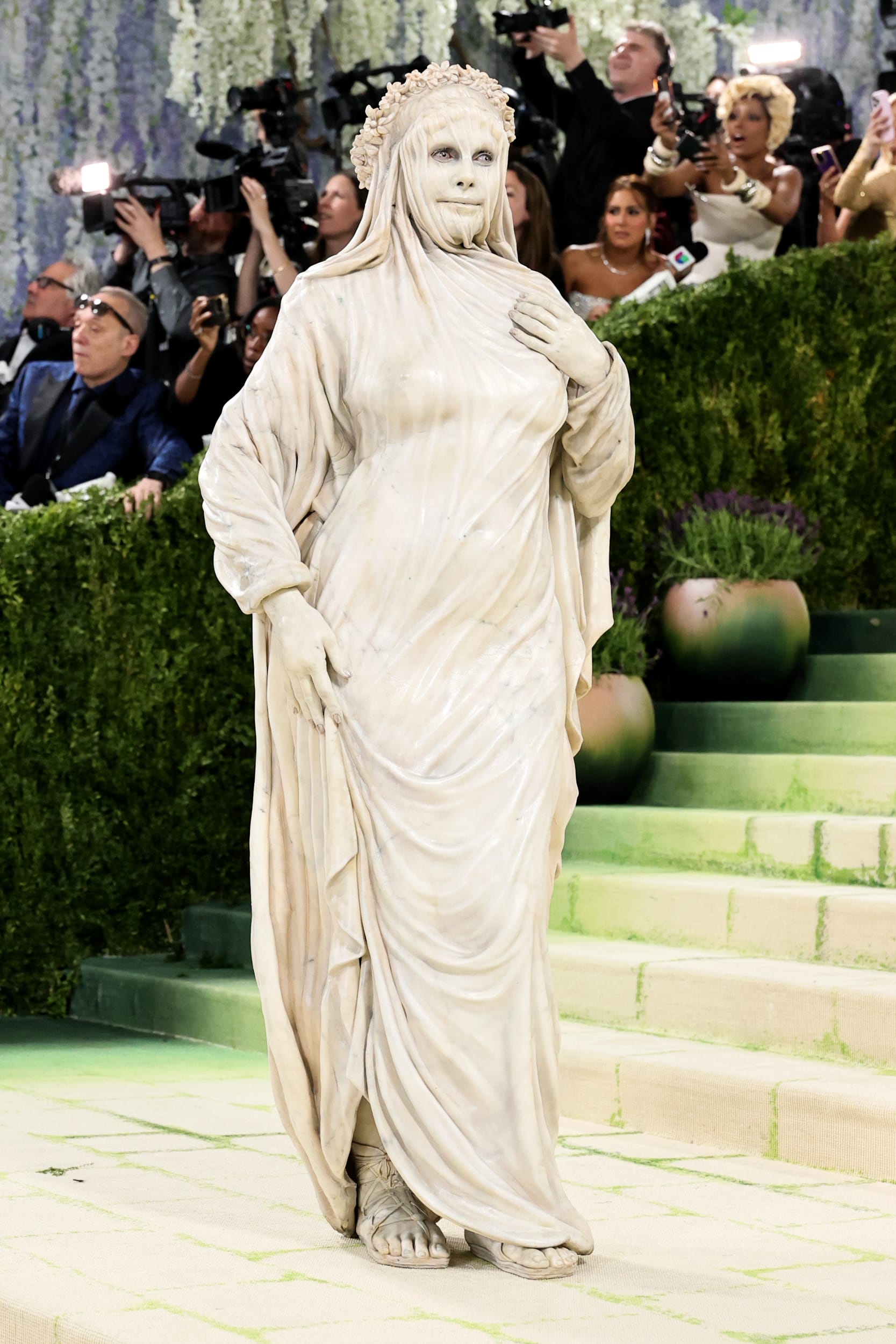 Heidi Klum dressed as a marble statue.