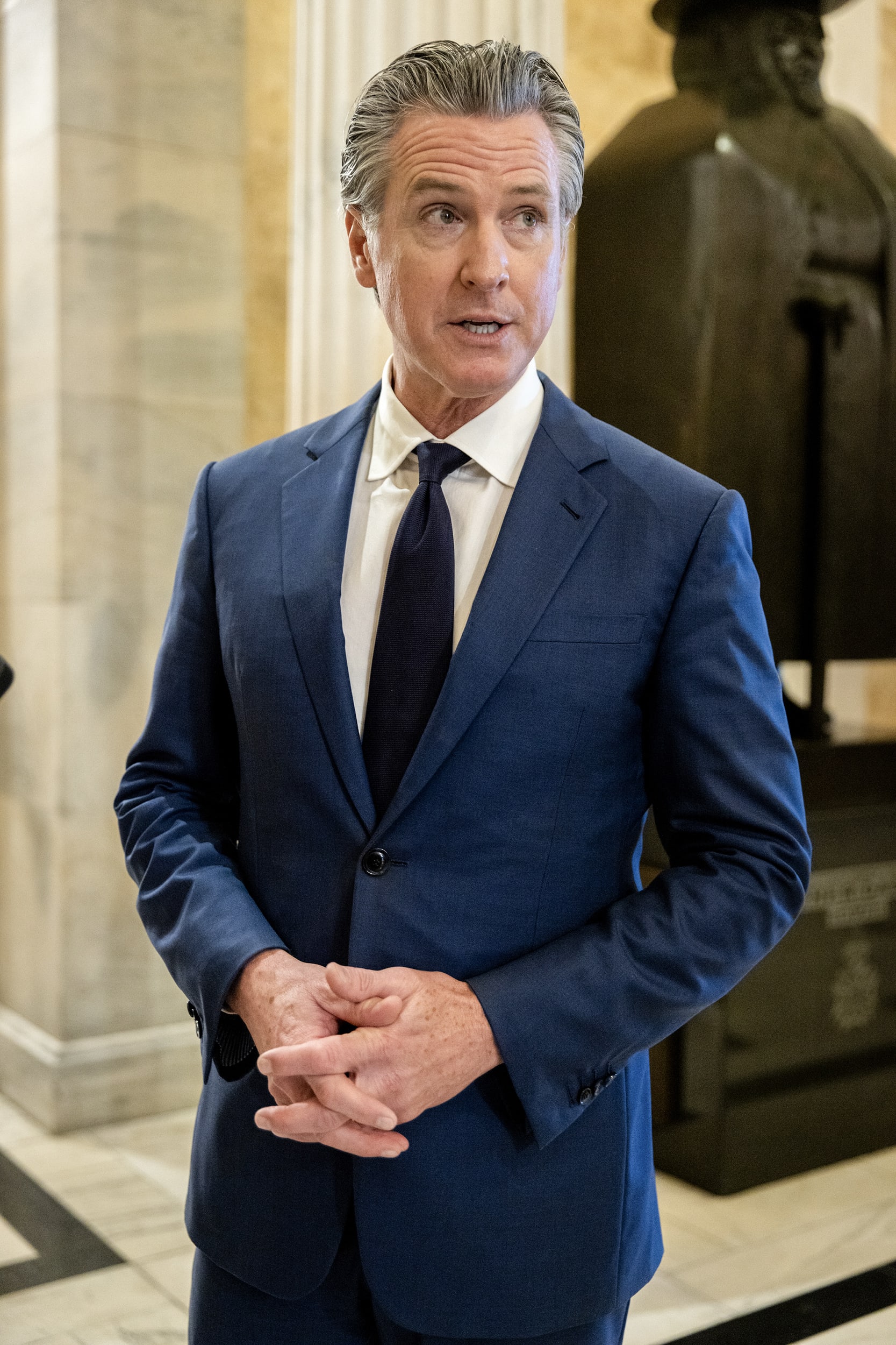Gavin Newsom standing inside the U.S. Capitol