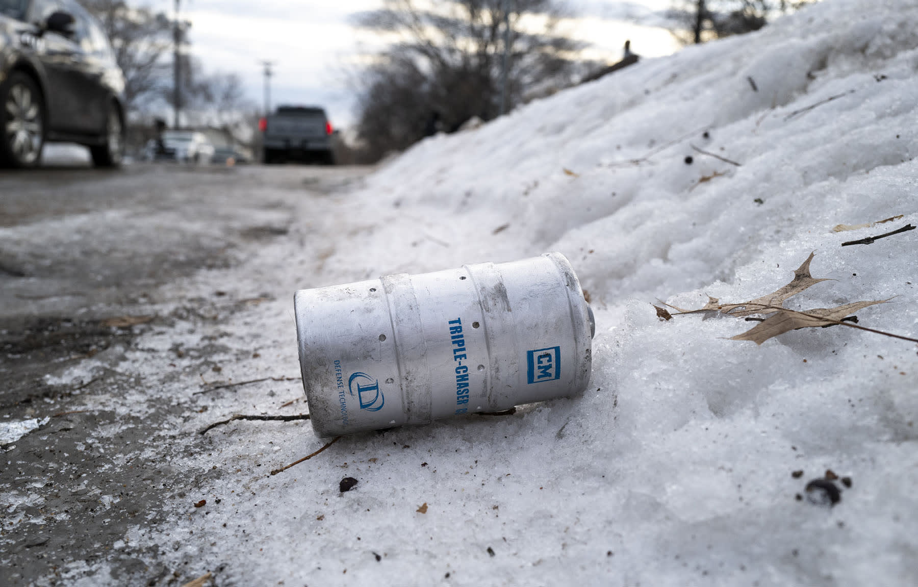 A container of CS gas lies in the street near the site where a shooting by federal agents occurred last night on January 15, 2026 in Minneapolis, Minnesota.