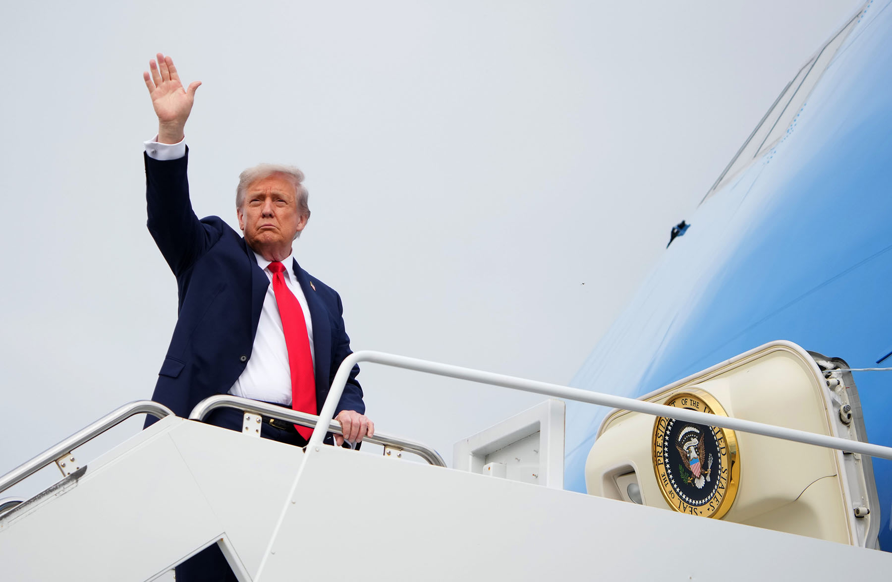 President Donald Trump boards Air Force One