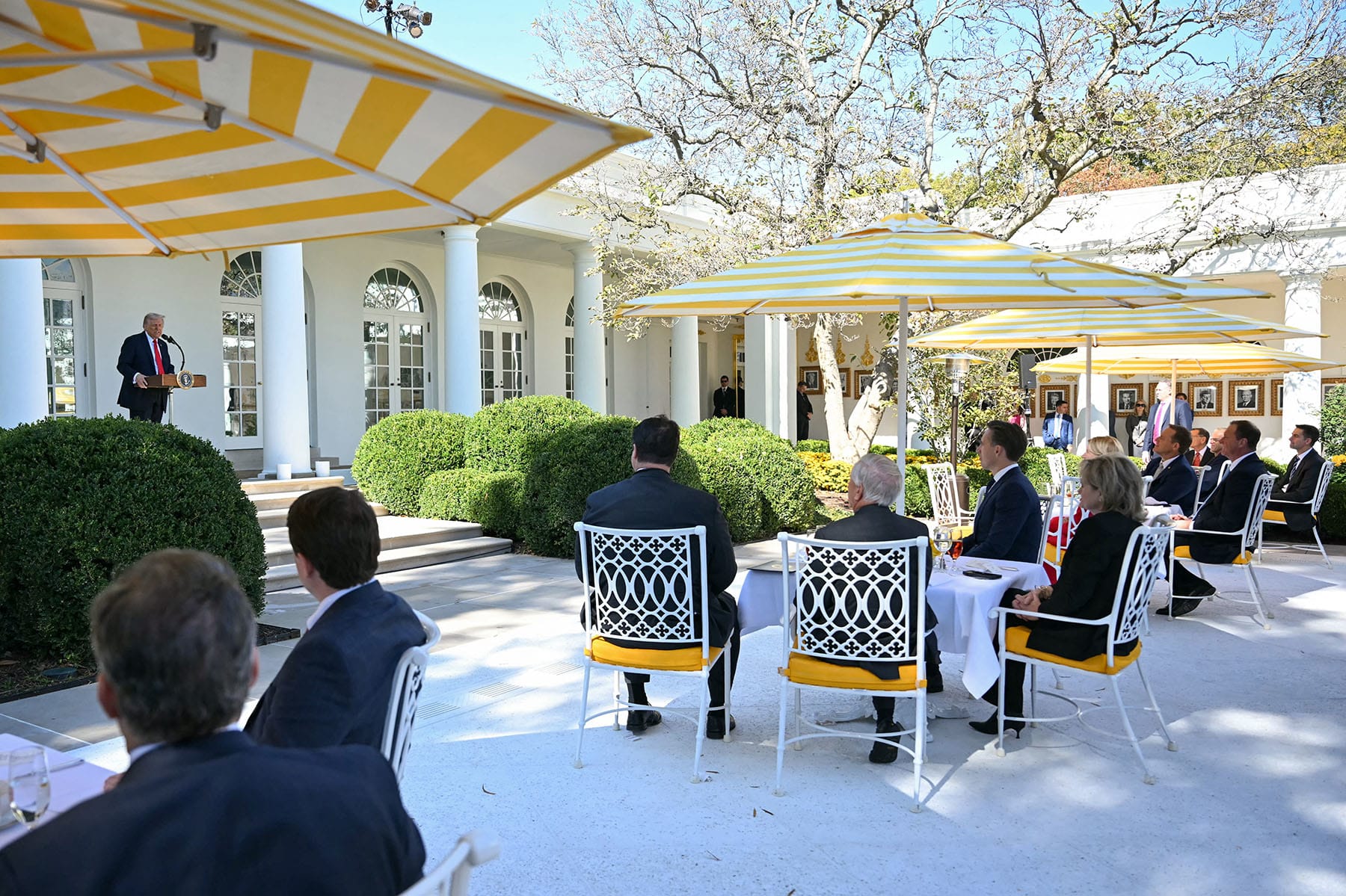 Republican Senators and guests listen as President Donald Trump speaks during a "Rose Garden Club" lunch in the Rose Garden of the White House on Oct. 21, 2025.