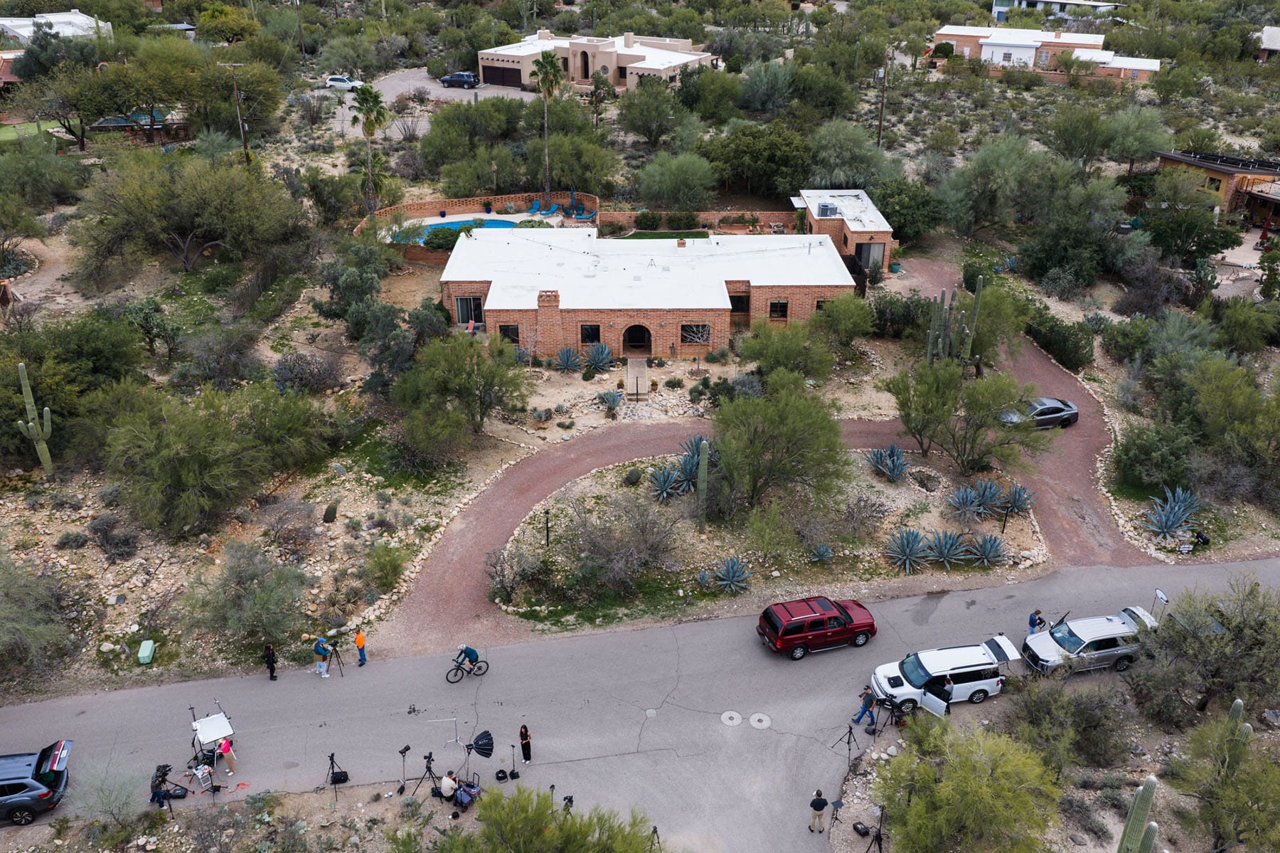 Members of the press work outside the home of Nancy Guthrie, the missing mother of “Today” show host Savannah Guthrie, Thursday, Feb. 5, 2026, in Tucson, Ariz. 