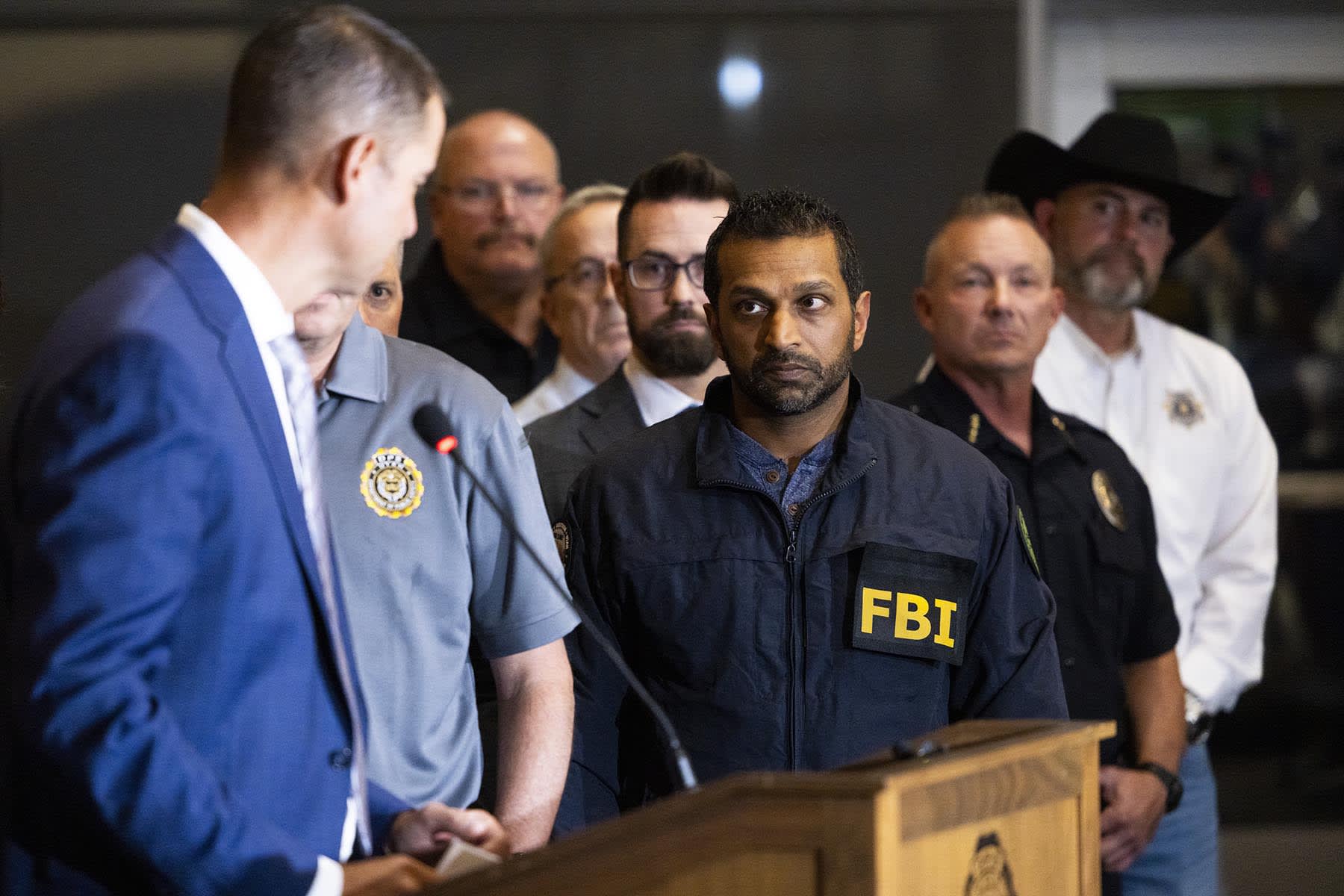 FBI director Kash Patel listens as Utah Department of Public Safety commissioner Beau Mason speaks