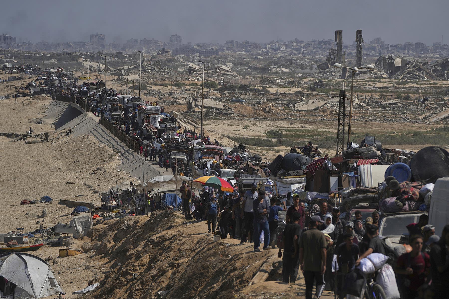 Displaced Palestinians flee northern Gaza along the coastal road toward the south on Tuesday, Sept. 16, 2025. 