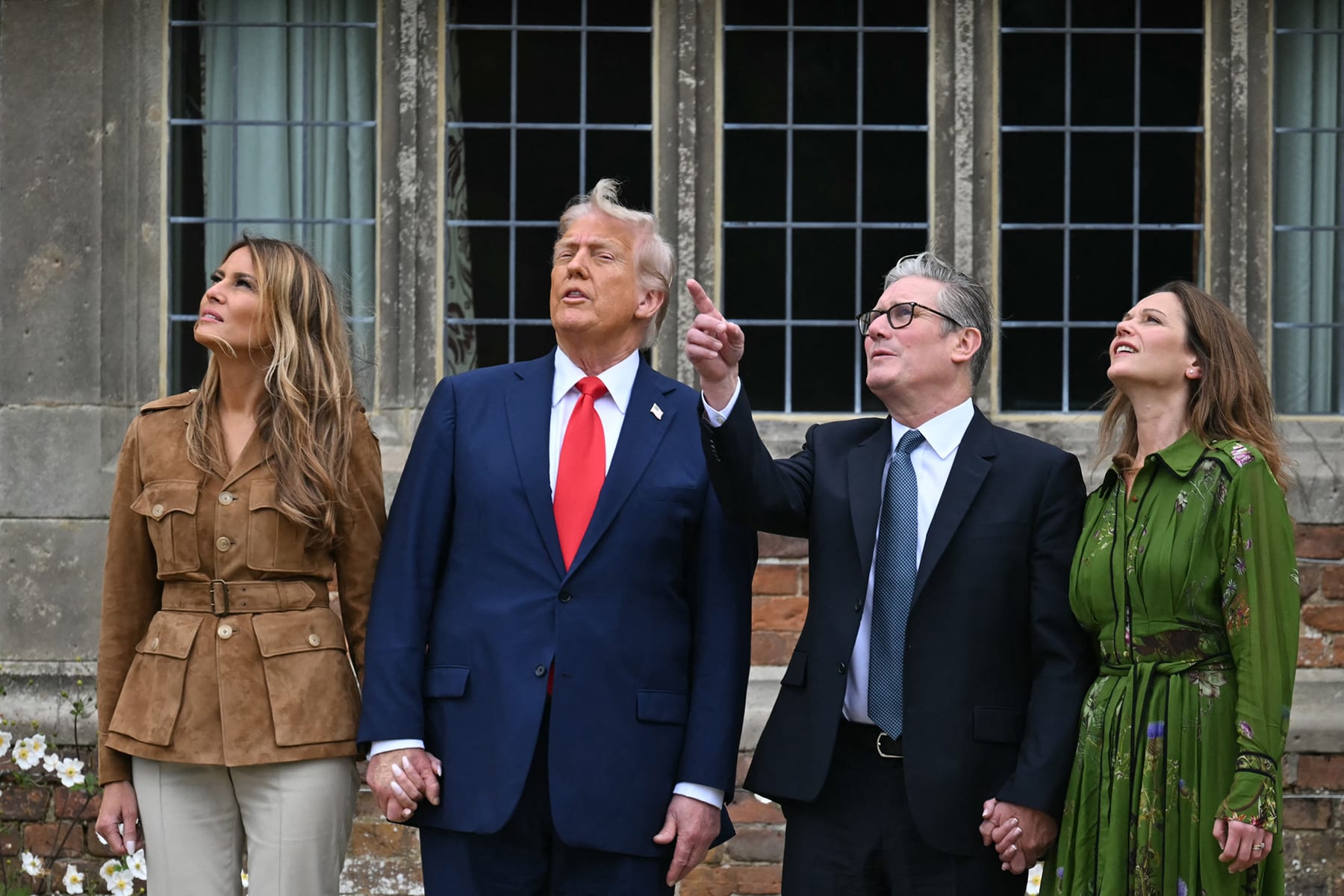 First lady Melania Trump, President Donald Trump, Britain's Prime Minister Keir Starmer and Victoria Starmer watch a display by members of the Red Devils parachute team at Chequers, in Aylesbury, central England, on September 18, 2025.