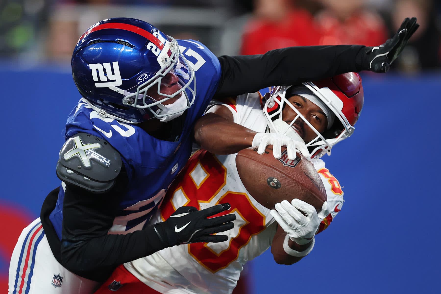 Tyquan Thornton of the Kansas City Chiefs makes a reception over Andru Phillips of the New York Giants during the fourth quarter at MetLife Stadium on September 21, 2025 in East Rutherford, New Jersey. 