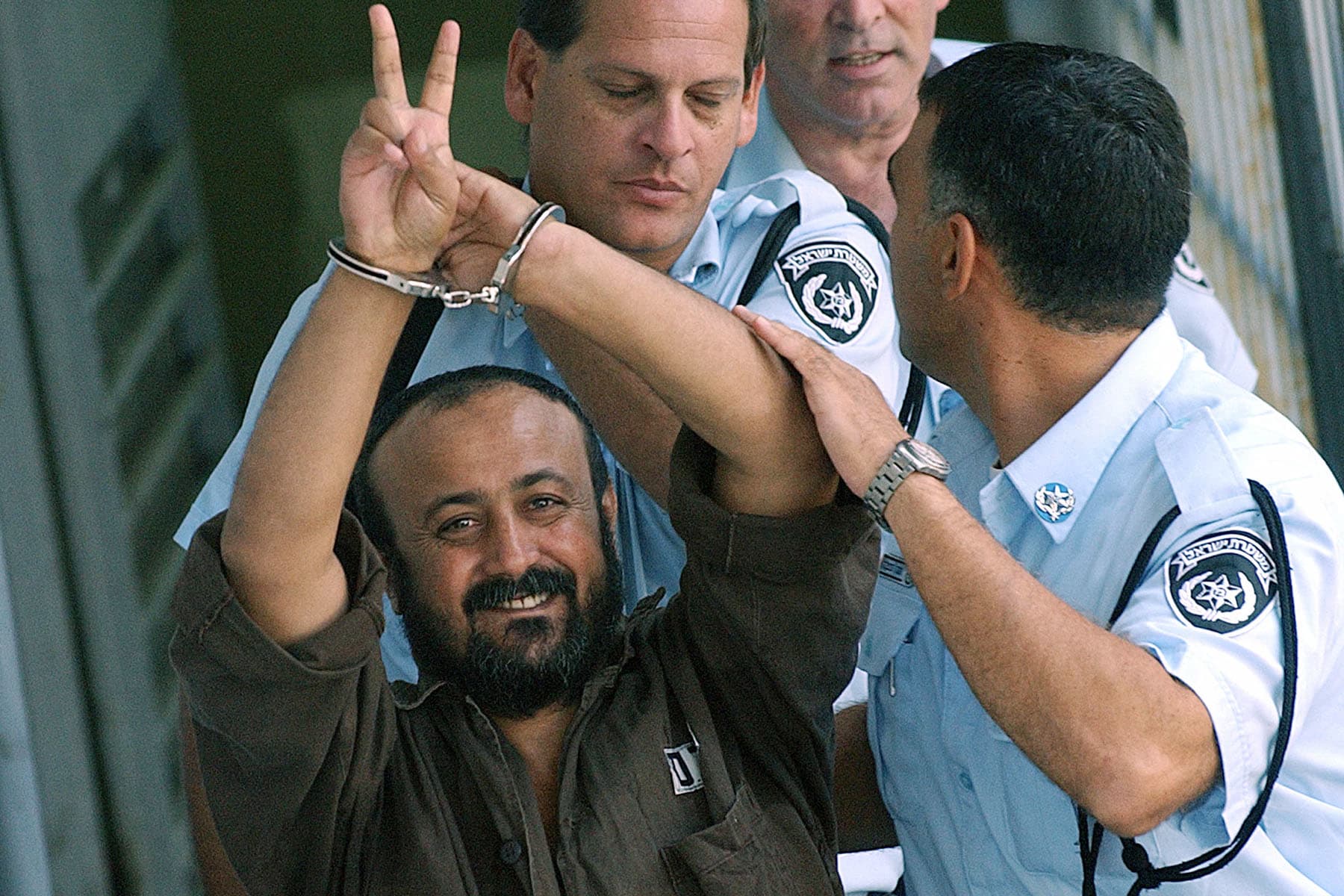 Marwan Barghouti is led by Israeli police in 2003 after appearing before a Tel Aviv court.