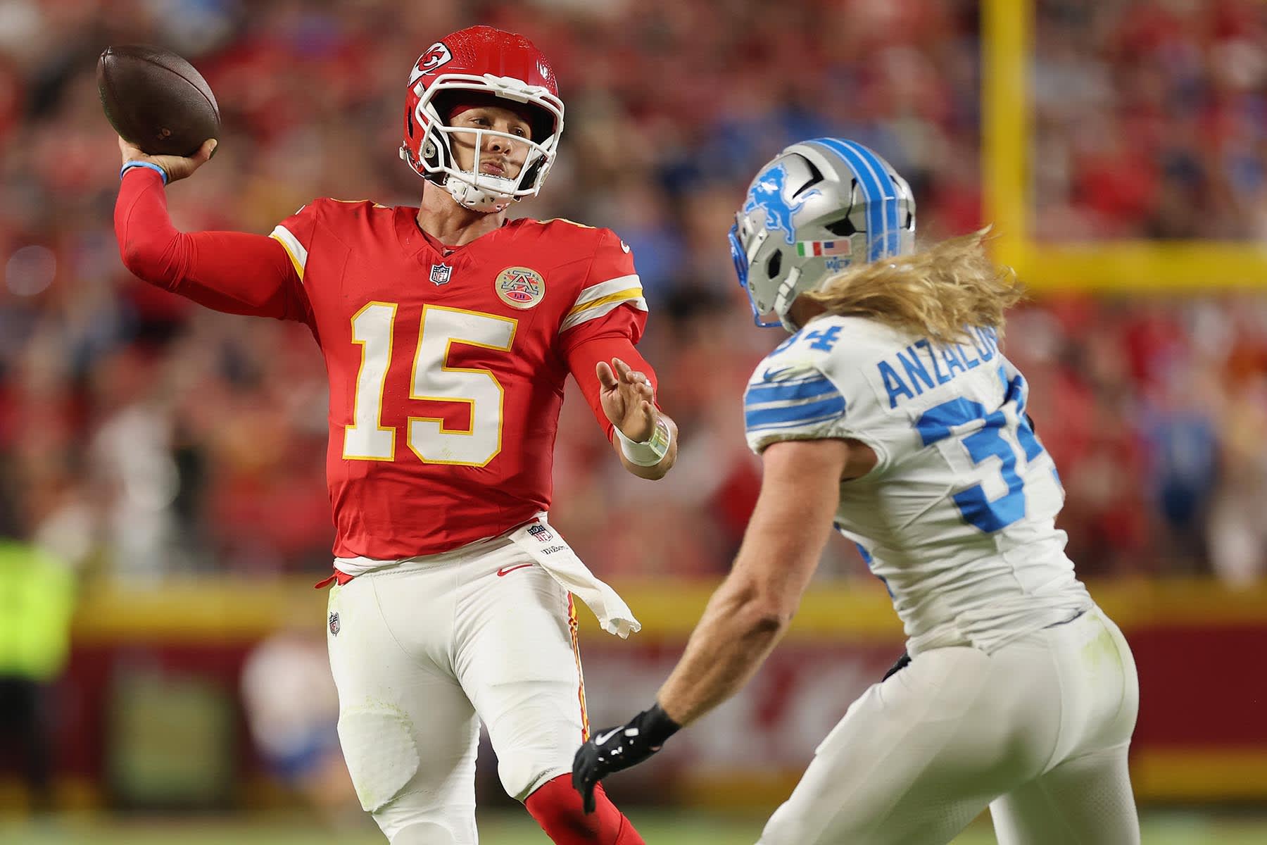 Patrick Mahomes of the Kansas City Chiefs passes the ball defended by Alex Anzalone of the Detroit Lions during the second quarter on Oct. 12, 2025 in Kansas City, Mo.