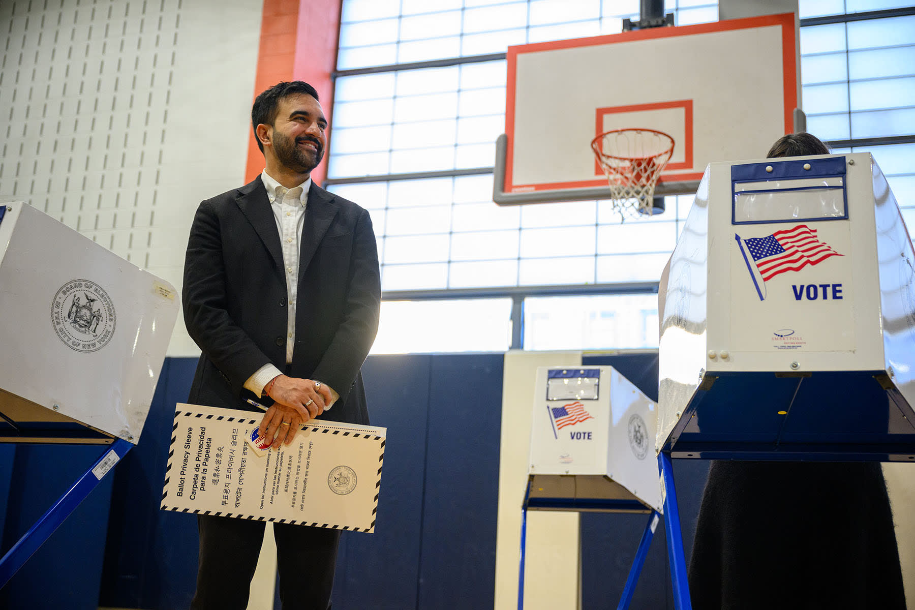 Democratic Mayoral Candidate Zohran Mamdani waits for his wife, Rama Duwaji, while voting at The Frank Sinatra School of the Arts on Nov. 4, 2025 in the Queens borough of New York.