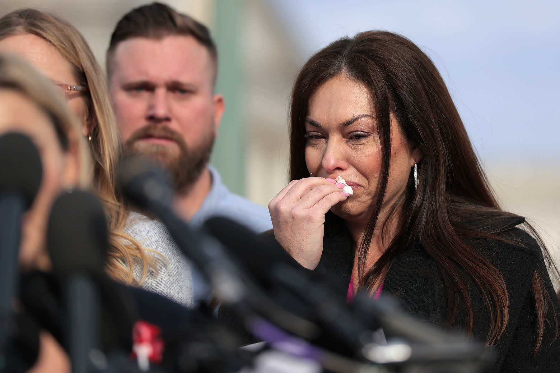 Epstein abuse survivor Haley Robson reacts during a news conference with lawmakers on the Epstein Files Transparency Act outside Capitol on Nov. 18, 2025.