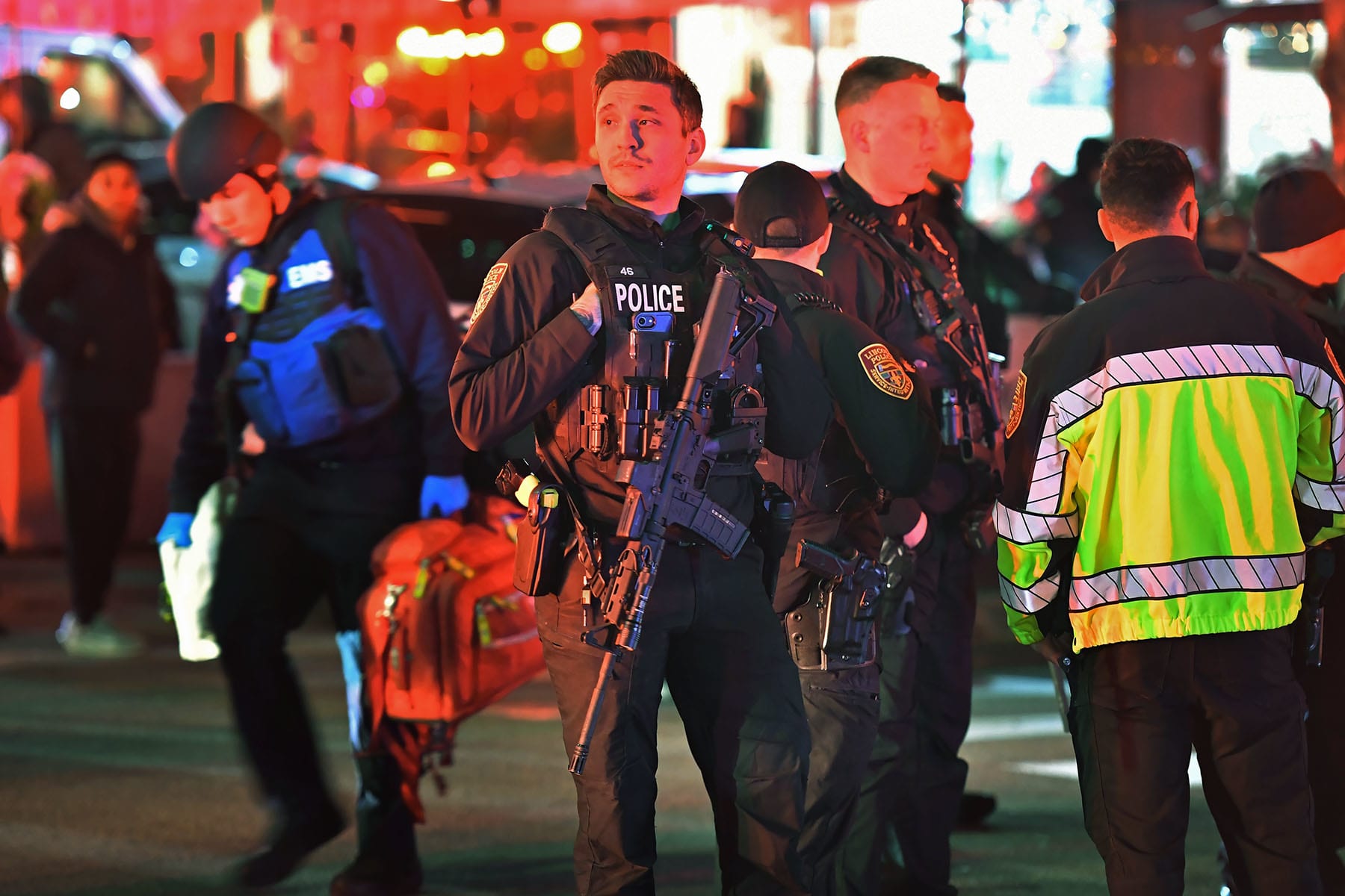 Police gather near Brown University in Providence, R.I., on Saturday, Dec. 13, 2025, during the investigation of a shooting. 