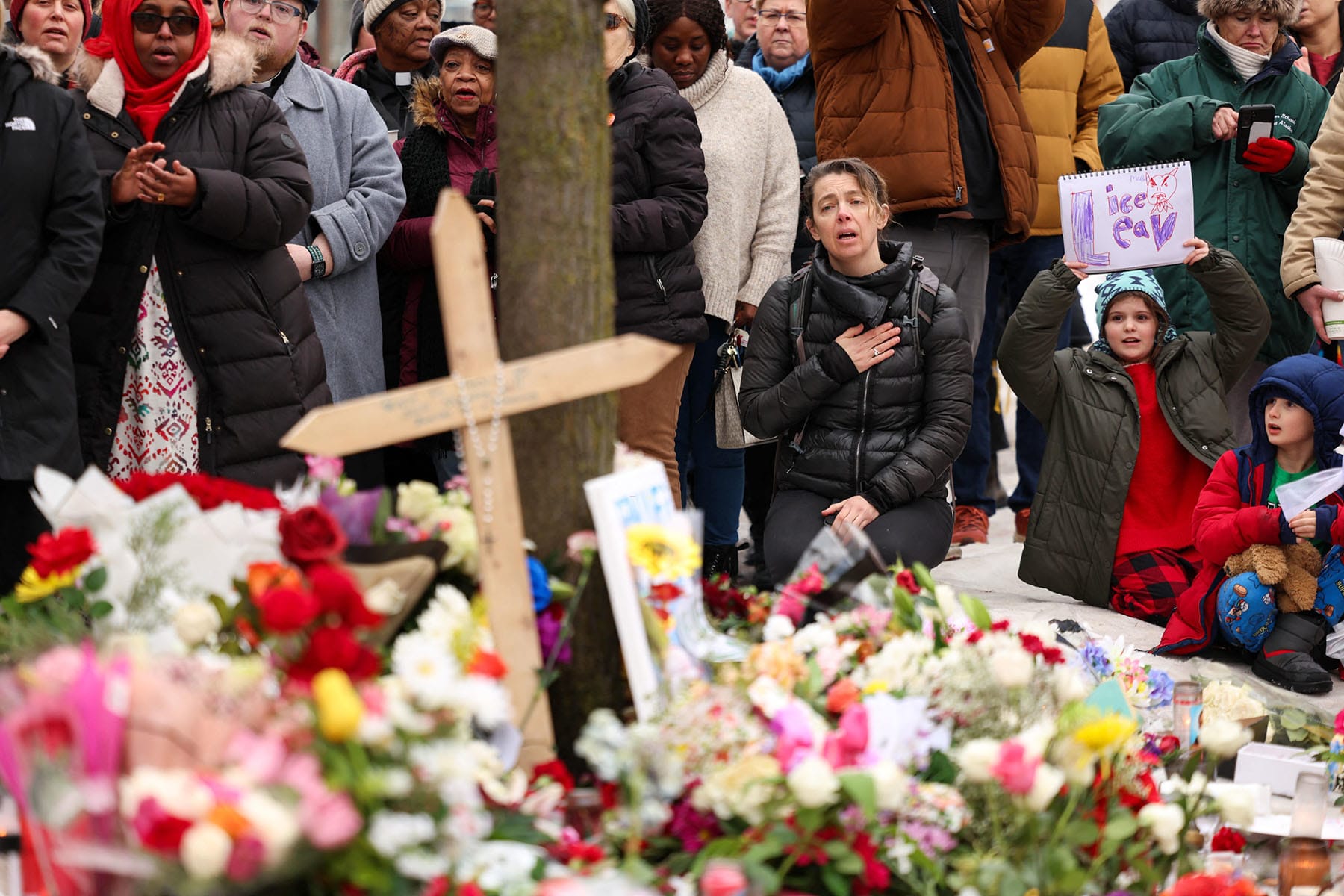 People gather at the street where 37-year-old Renee Nicole Good was shot and killed at point blank range on Jan. 7 by an ICE in Minneapolis, Minnesota, on January 8, 2026. 