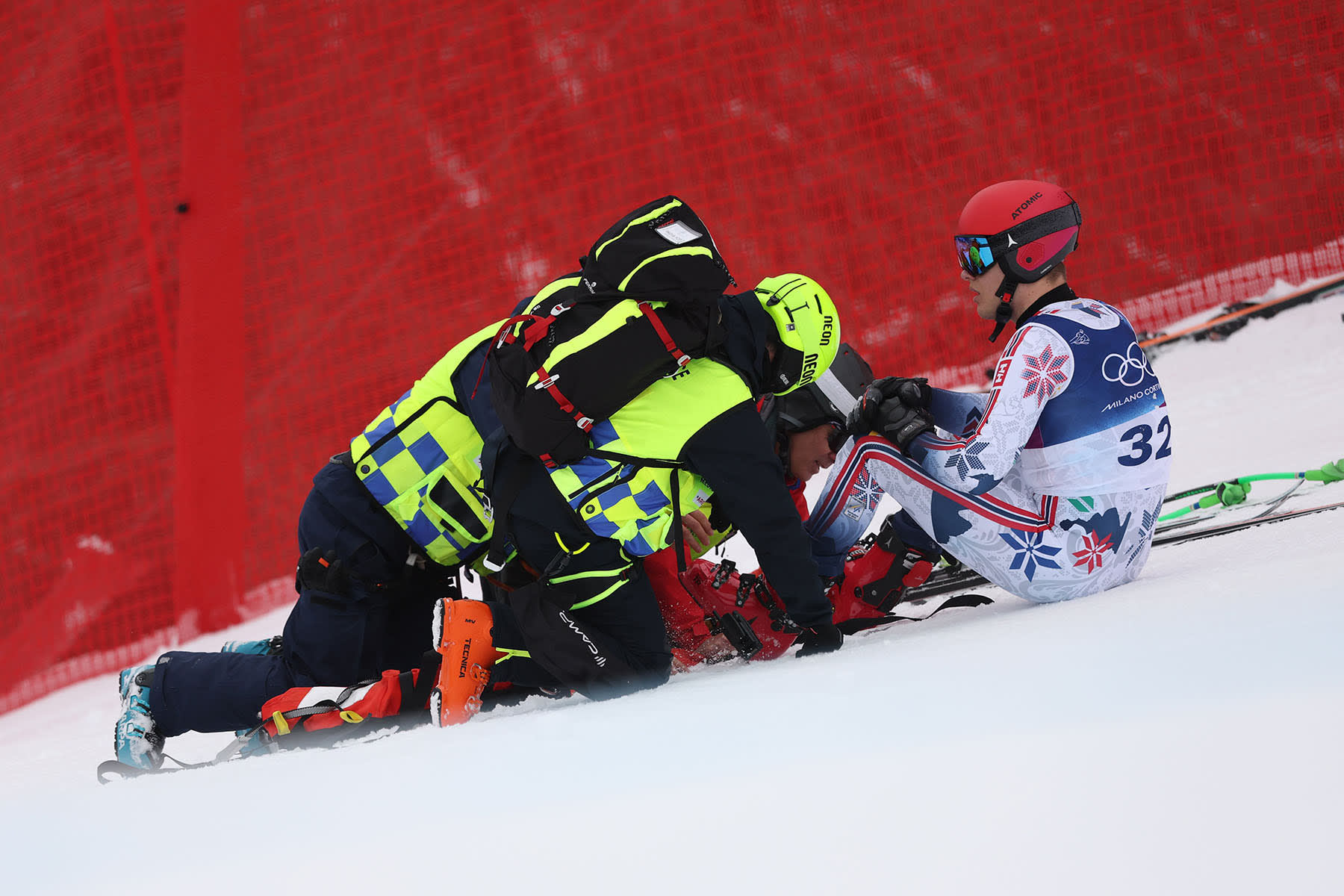 Fredrik Moeller of Norway is tended to by medics 