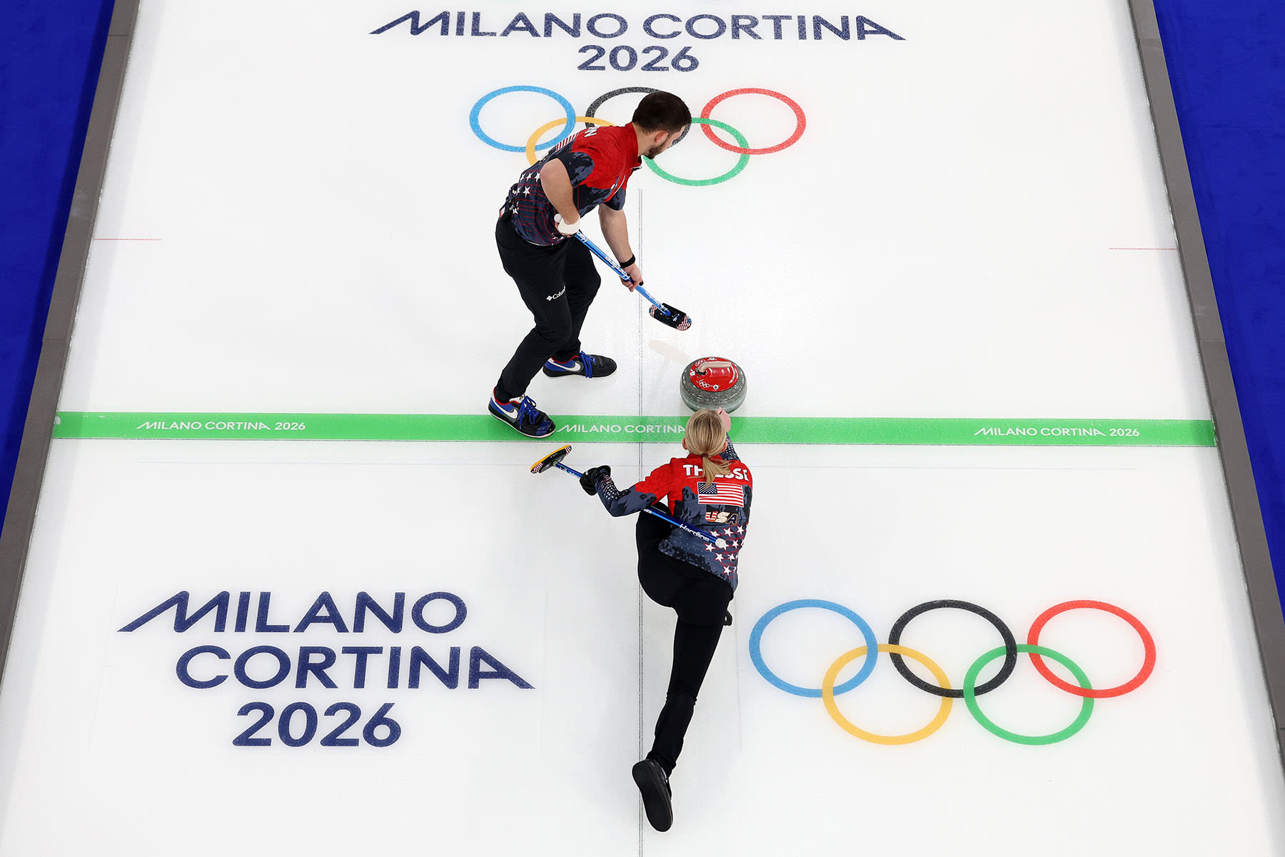 Korey Dropkin and Cory Thiesse of the U.S. compete against Italy during the mixed doubles round robin on Feb. 9, 2026 in Cortina d'Ampezzo, Italy. 
