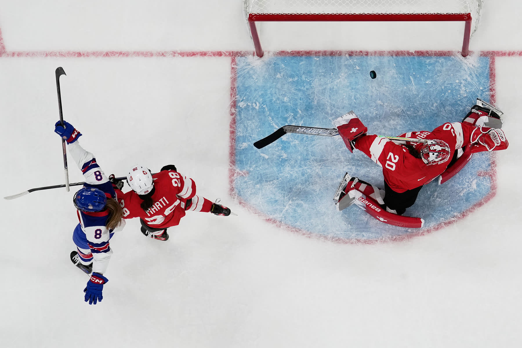 Shot from above of Haley Winn scoring past Switzerland's gaolie Andrea Brandli 