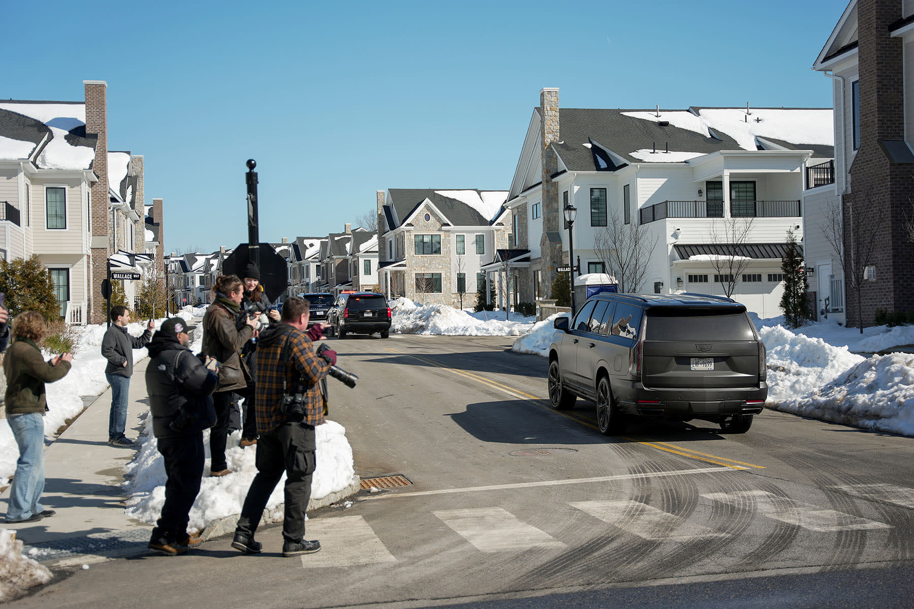 A motorcade carrying former President Bill Clinton approaches the Chappaqua Performing Arts Center