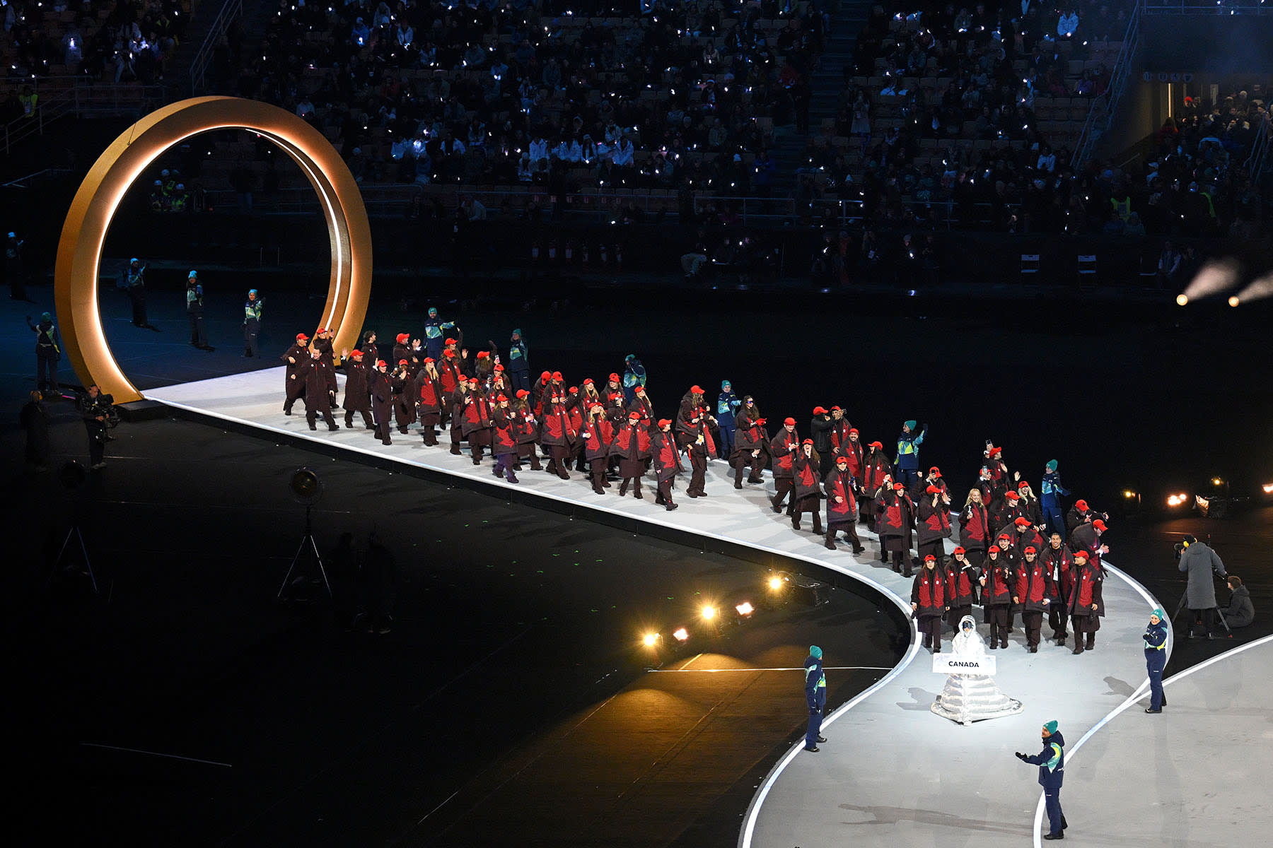 Athletes of Team Canada enter the stadium.