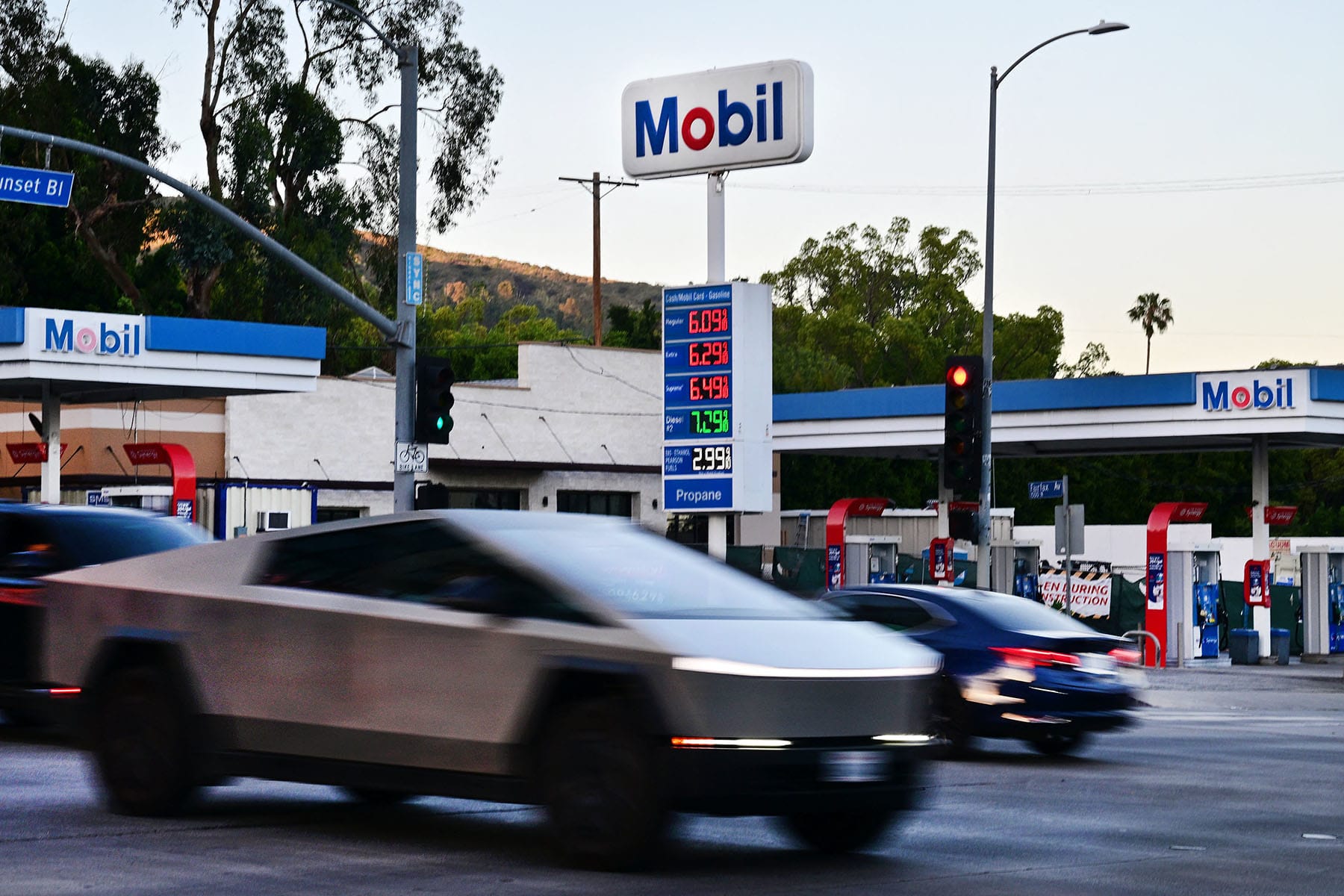 Gas prices topping $6 a gallon are displayed at a Mobil gas station on Sunset Boulevard in Los Angeles on April 6, 2026.