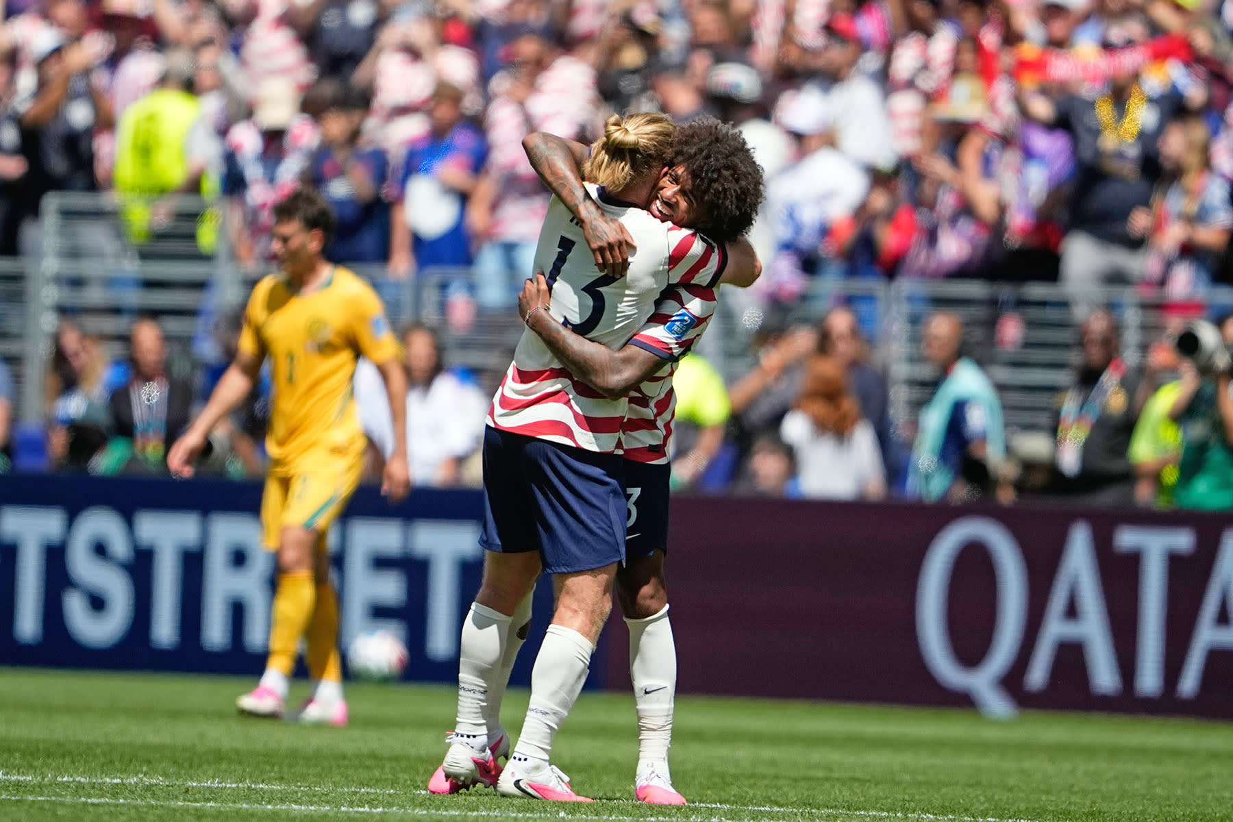U.S. Tim Ream celebrates with Chris Richards, right, at the end of the World Cup Group D soccer match between the United States and Australia in Seattle, Friday, June 19, 2026.