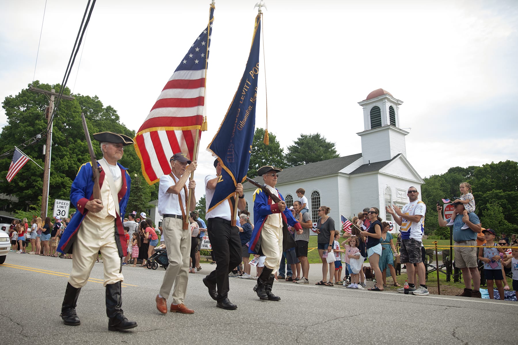 Marchers in an Independence Day parade in Gilmanton, N.H., on July 4, 2026.