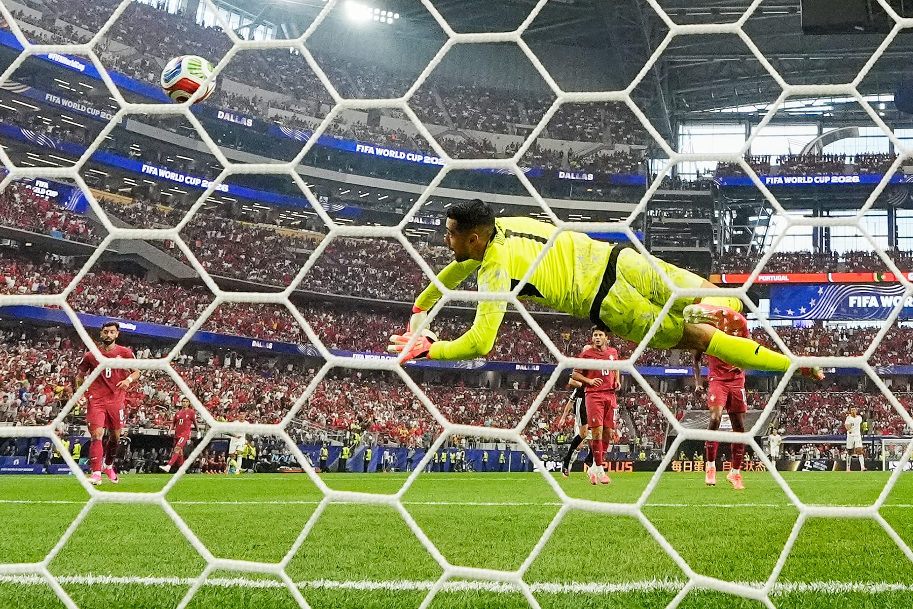 Portugal goalkeeper Diogo Costa saves a shot by Spain's Alex Baena during the World Cup round of 16 soccer match between Portugal and Spain in Arlington, Texas, near Dallas, Monday, July 6, 2026.