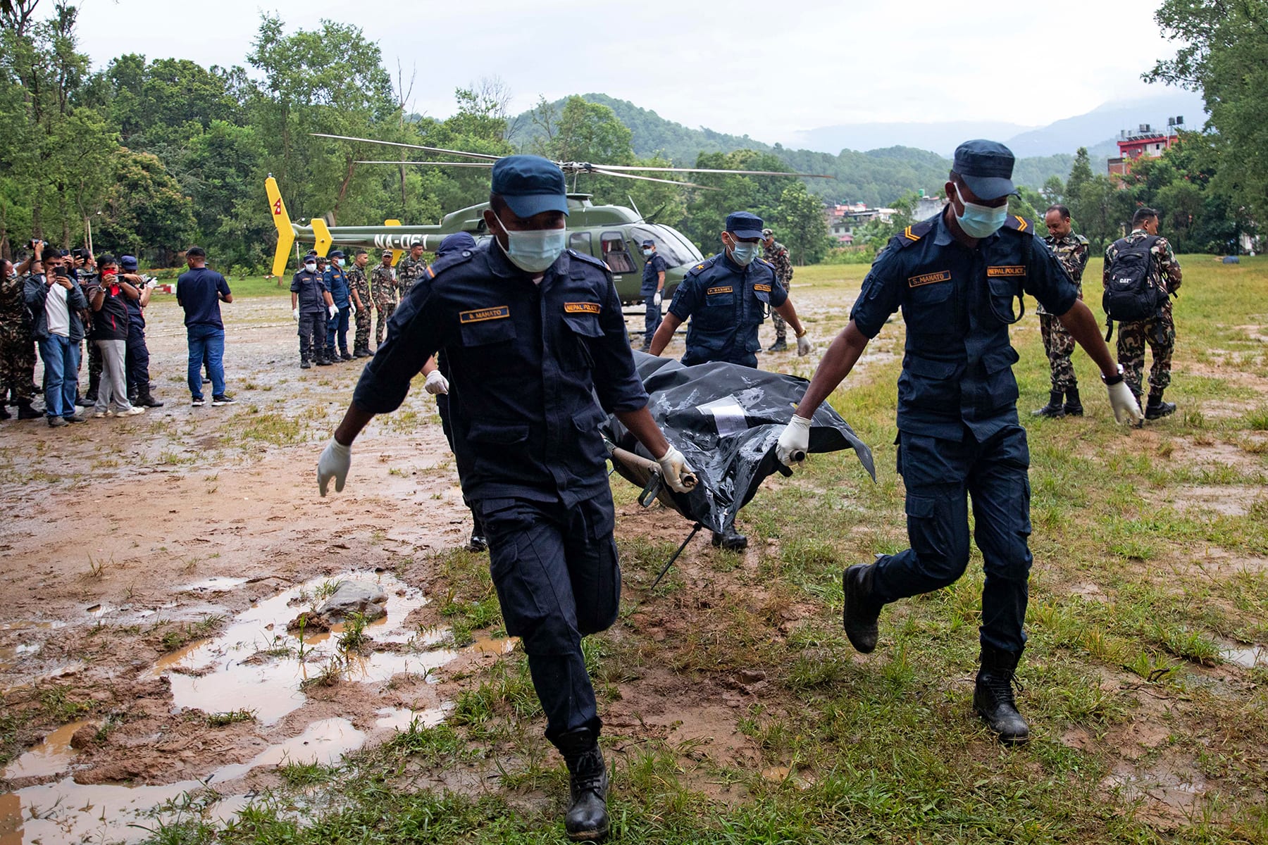 Nepali Army personnel carry bodies of deceased victims during rescue operations in Nepal's Nuwakot district on August 28, 2026. 