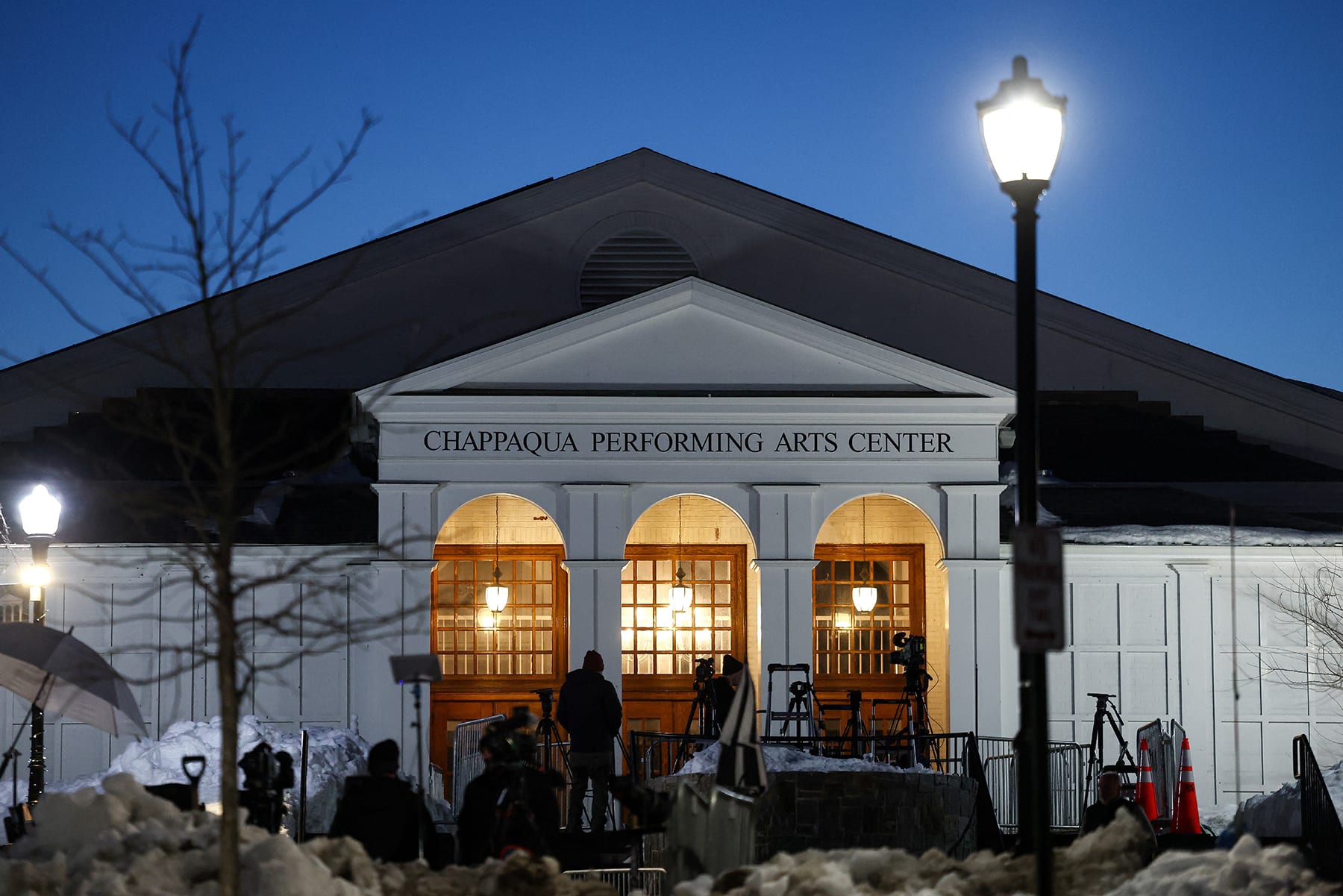 Media crews gather in front of The Chappaqua Performing Arts Center in Chappaqua, N.Y., early February 27, 2026, ahead of the deposition of Bill Clinton. 