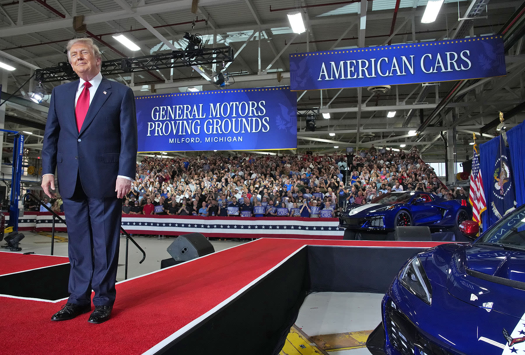 President Donald Trump greets the audience at General Motors’ Milford Proving Grounds on July 27, 2026 in Milford, Mich.