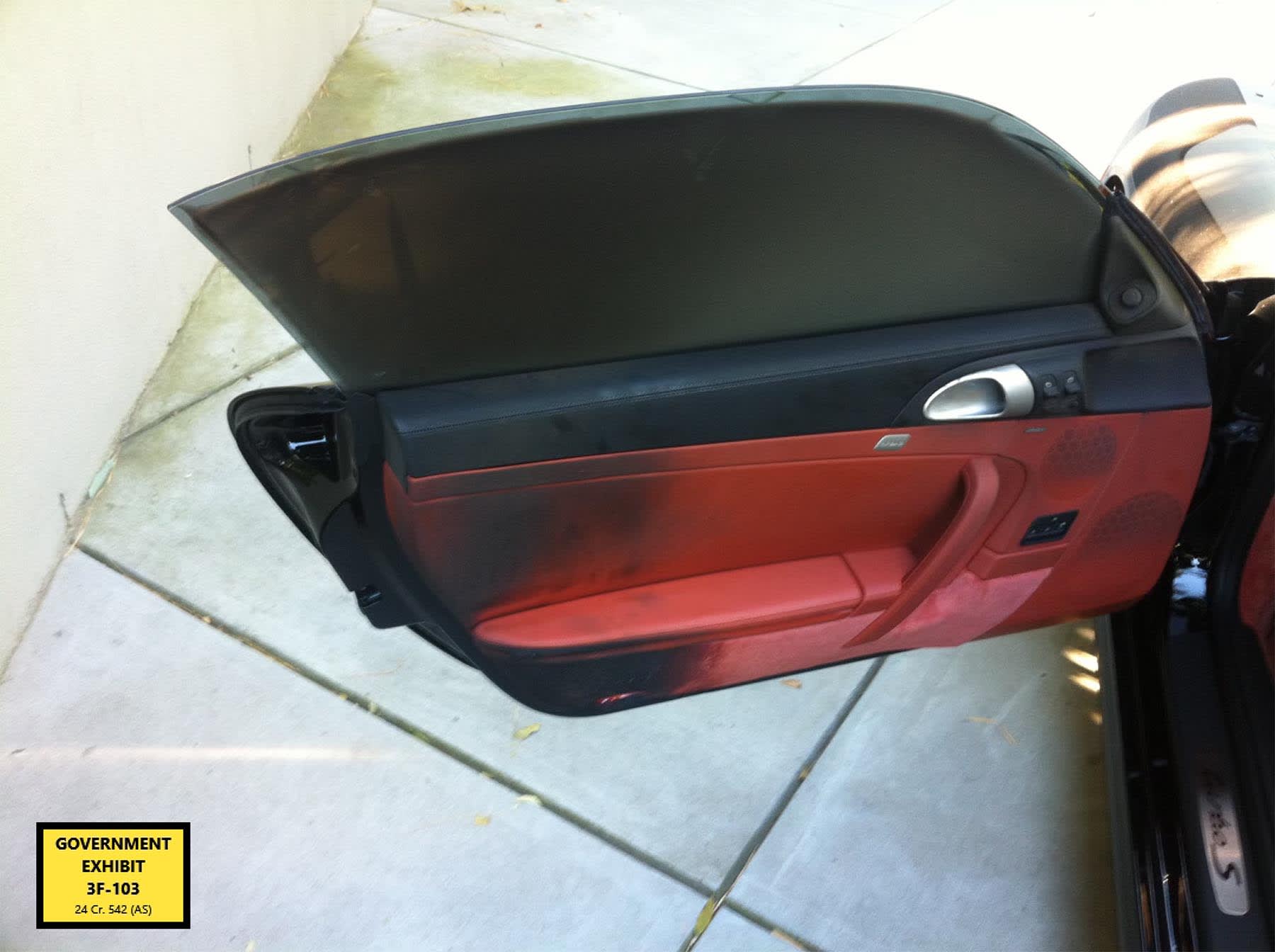 Exhibit presented in court during the trial of Sean "Diddy" Combs showing Kid Cudi's burned car.