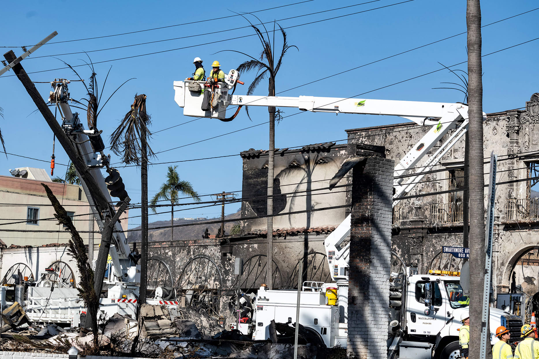 Crews begin working on power lines destroyed in the Palisades Fire