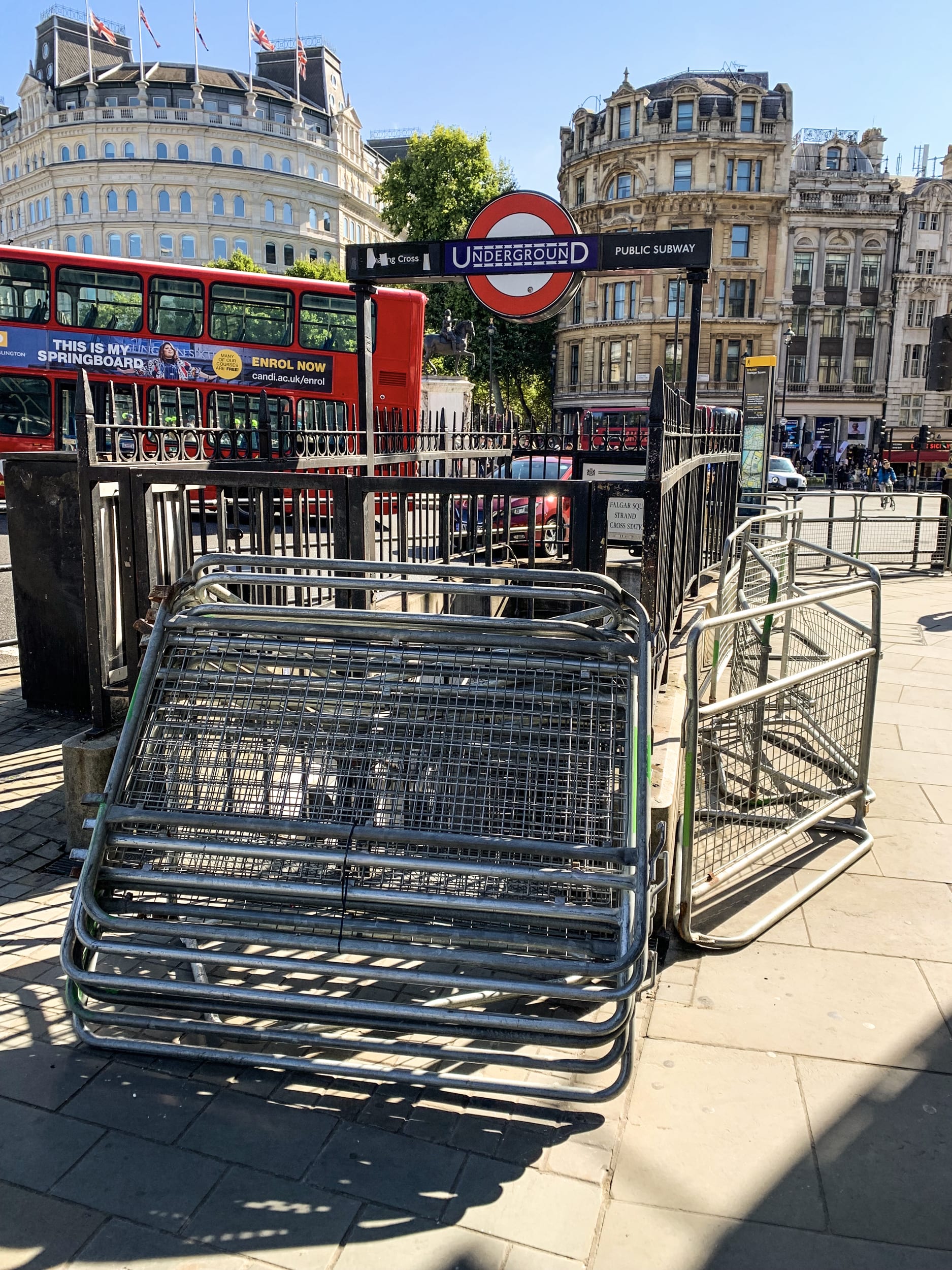 Fencing begins near a tube station across from Trafalgar Square near the entrance to The Mall, where a steady stream of mourners, many bearing flowers, have been heading for the palace, on Sept. 17, 2022.