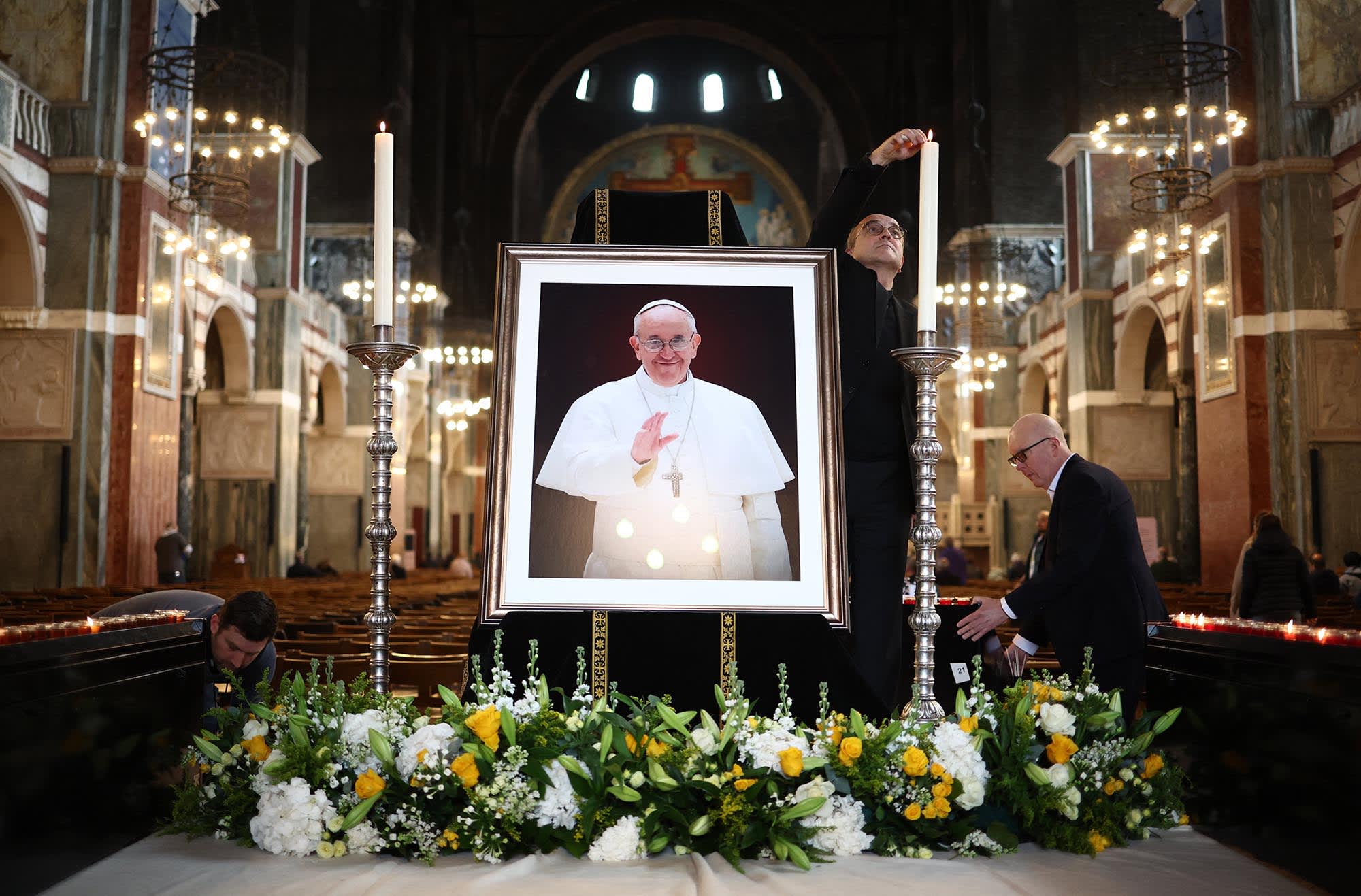 Cathedral staff set up an image of Pope Francis inside The Metropolitan Cathedral of the Most Precious Blood, informally known as Westminster Cathedral, in London on April 21, 2025.